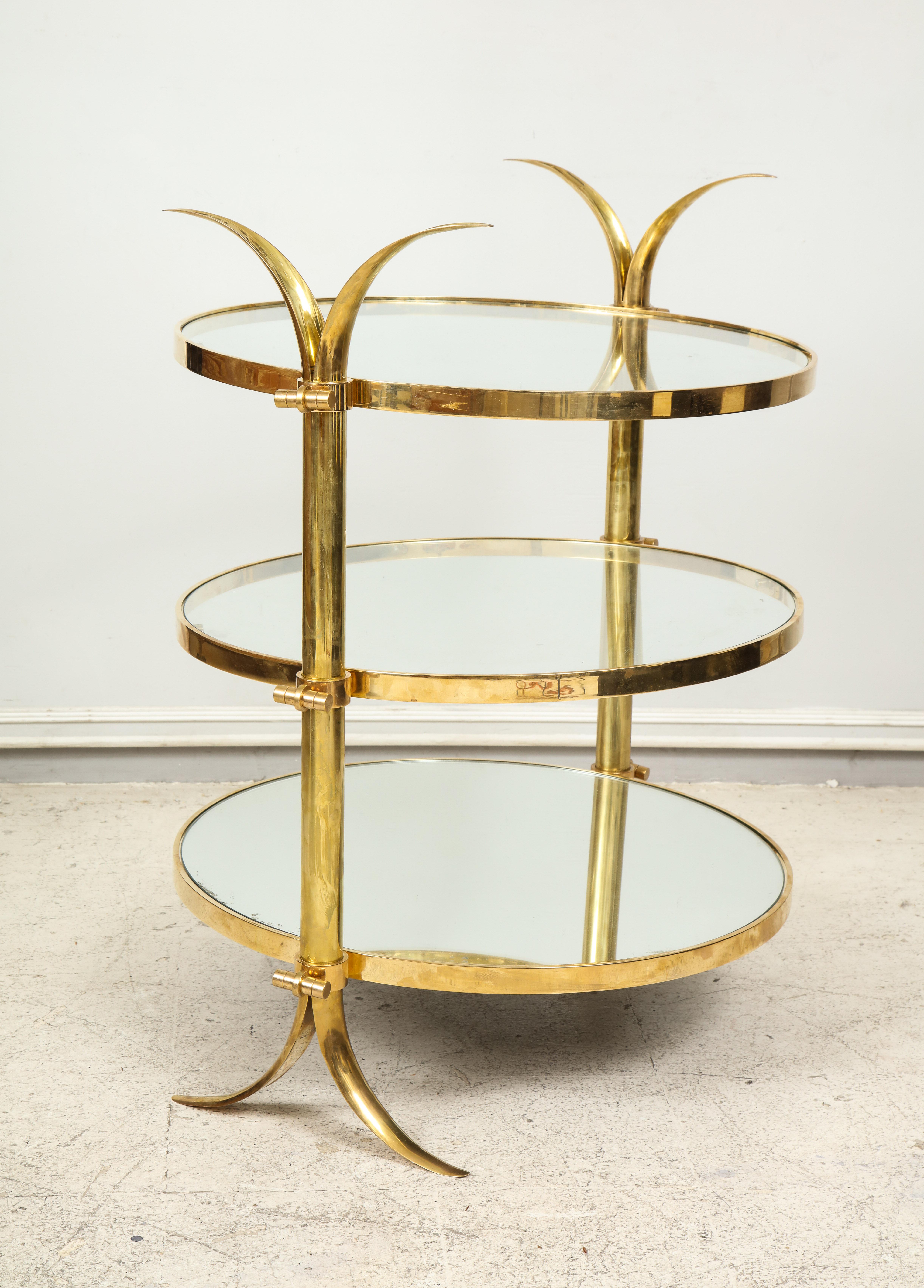 Bespoke three-tiered brass tulip table by Amir Khamneipur.
This table is customizable with a lead time of 8-10 weeks.