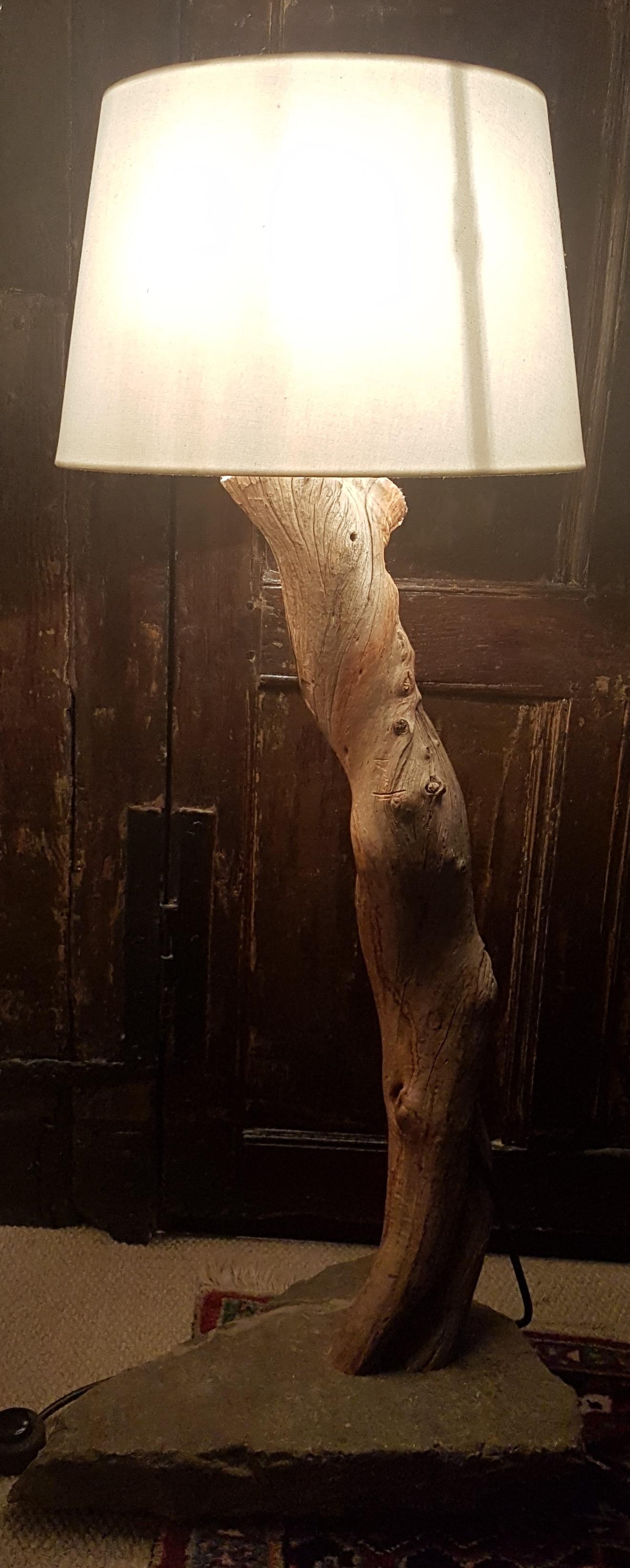 This is a very decorative and charming custom made floor lamp, it is constructed from a large solid trunk of Sandalwood from the north of West Australia. This trunk has then been angled and fitted to a carefully selected triangular slab of Horton