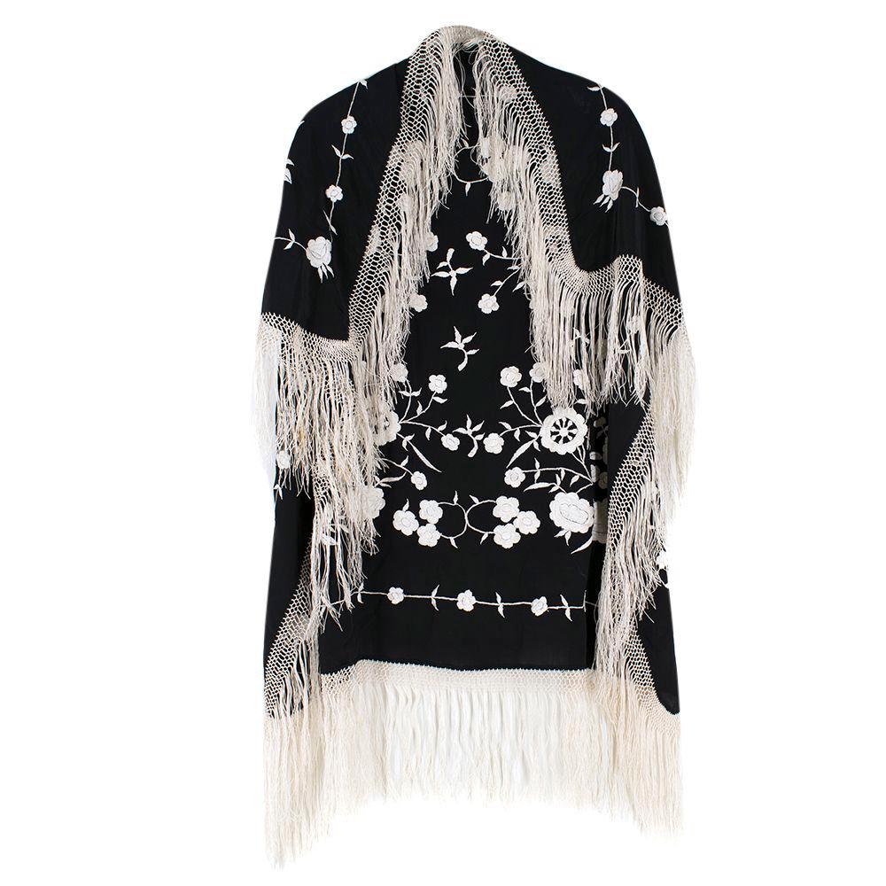 Bespoke Silk Crepe Embroidered Fringed Shawl
A very special piece from a 70's socialite

-black silk crepe scarf
-cream floral embroidery detail
-diamond crochet fringe trim 

width-89cm
height-89cm