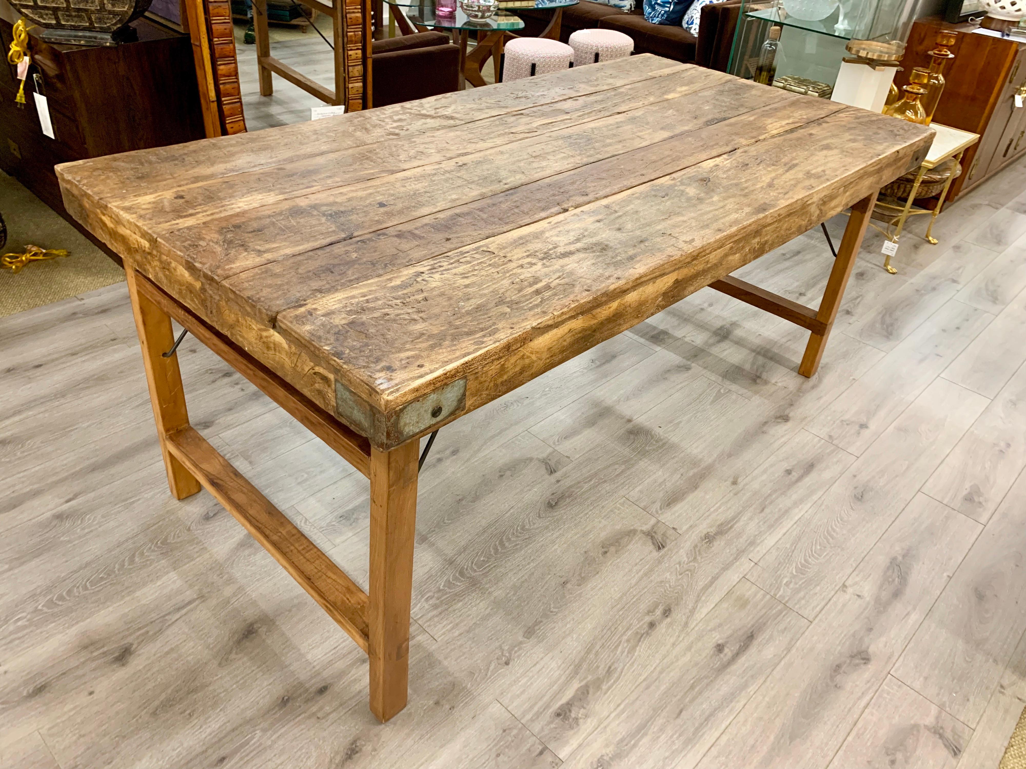 Great for a kitchen or dining room, depending on decor of course. This US made vintage 20th century waxed oak harvest table has great scale. Not too big or too small measuring just under six feet long.
  
