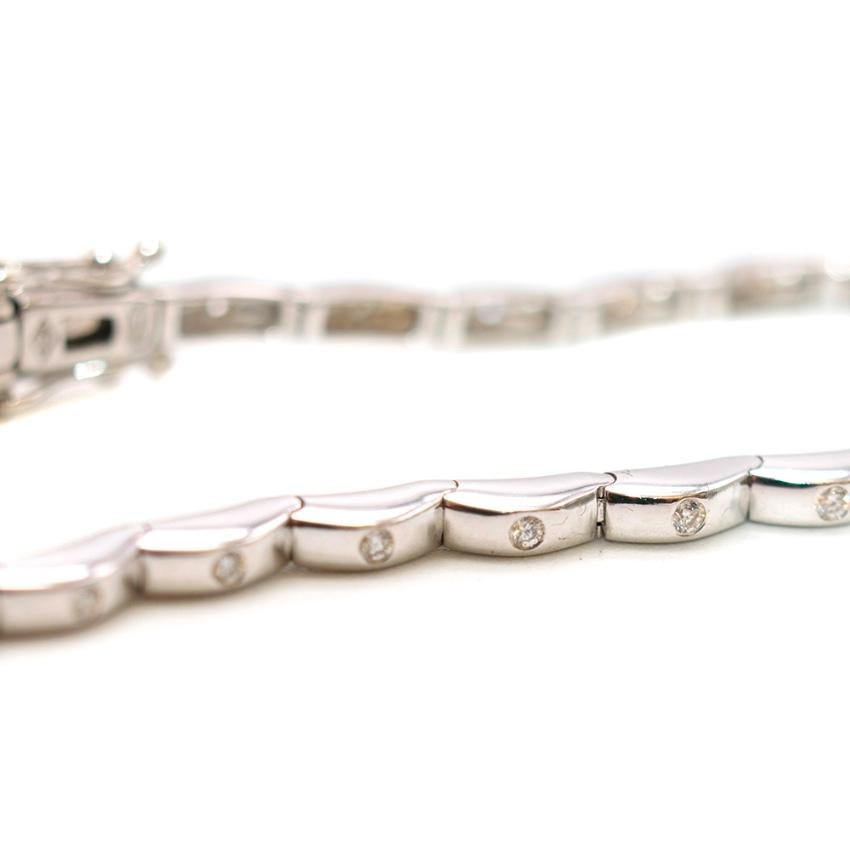 Bespoke White Gold Bracelet with Diamonds

- Originally purchased from Grays Antiques
- Push Clasp Closure 
- Linked Chain with Diamonds set in each link 
- White Gold Outer 
- Thin Bracelet 

Length: 20cm
Drop: 8cm 