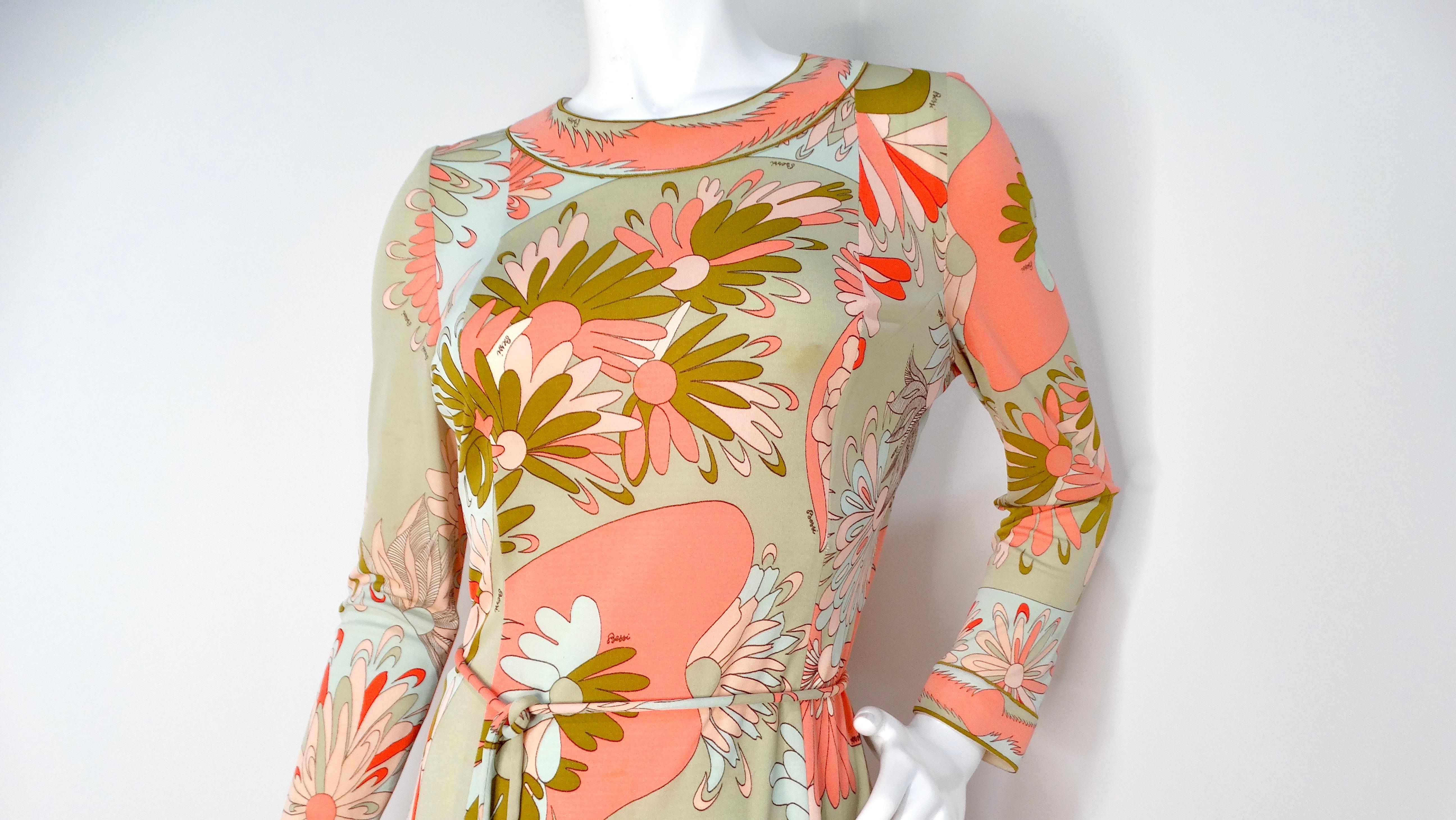 Step back into the vibrant 1960s with this stunning Bessi multi-color groovy floral print midi dress. This eye-catching piece features a delightful combination of pinks and greens that encapsulate the playful spirit of the era. With its long sleeves