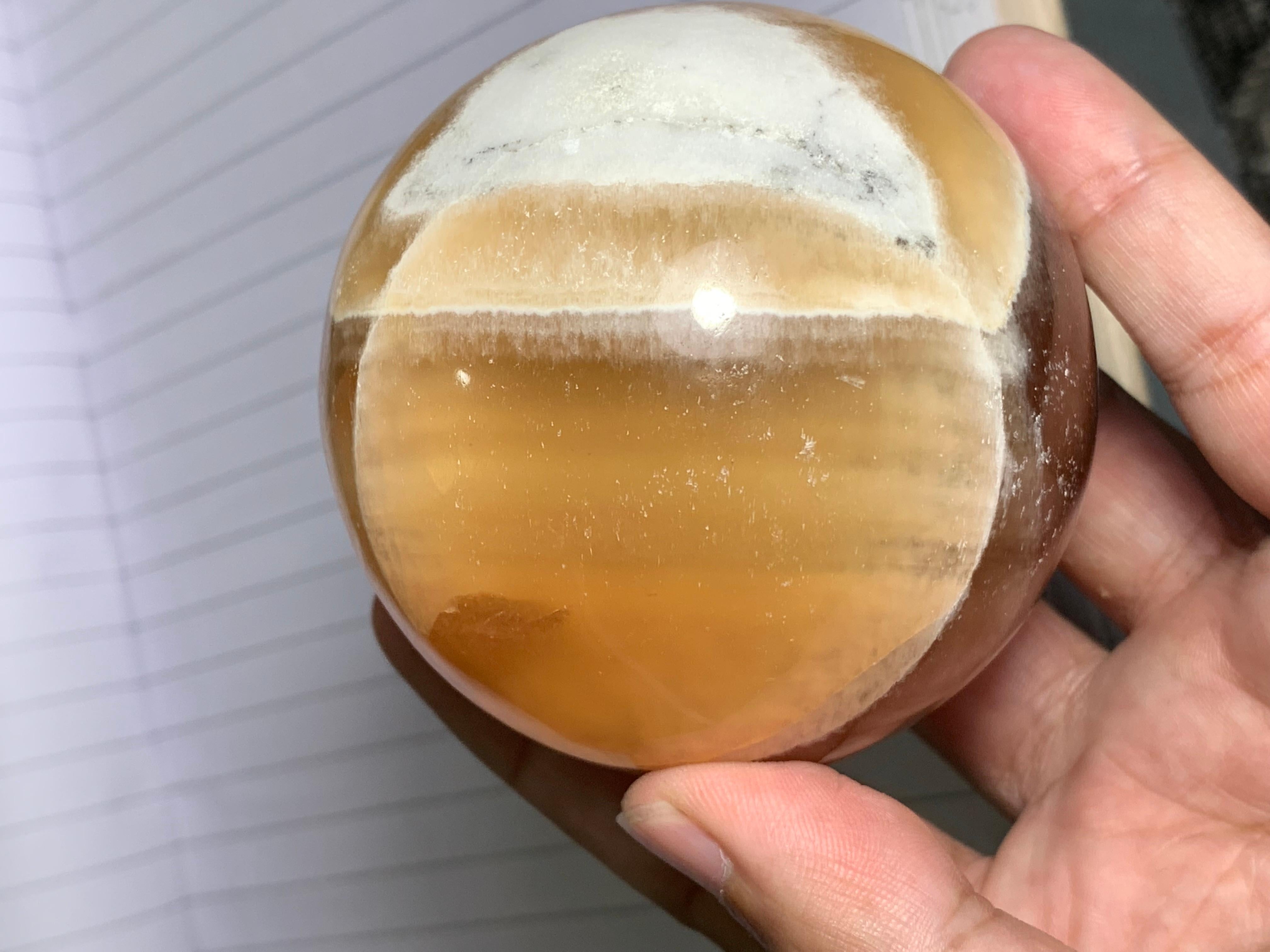 PRODUCT INFORMATION:

Specimen Type: Red Honey Calcite Crystal Sphere
Weight: 548 Gram
Dimension: H: 6.6 x W: 6.6 x D: 6.6 Cm
Origin: Pakistan 
Treatment: None

DESCRIPTION: 

Stunning 548-Gram Red Honey Calcite Sphere from Pakistan

Presenting the