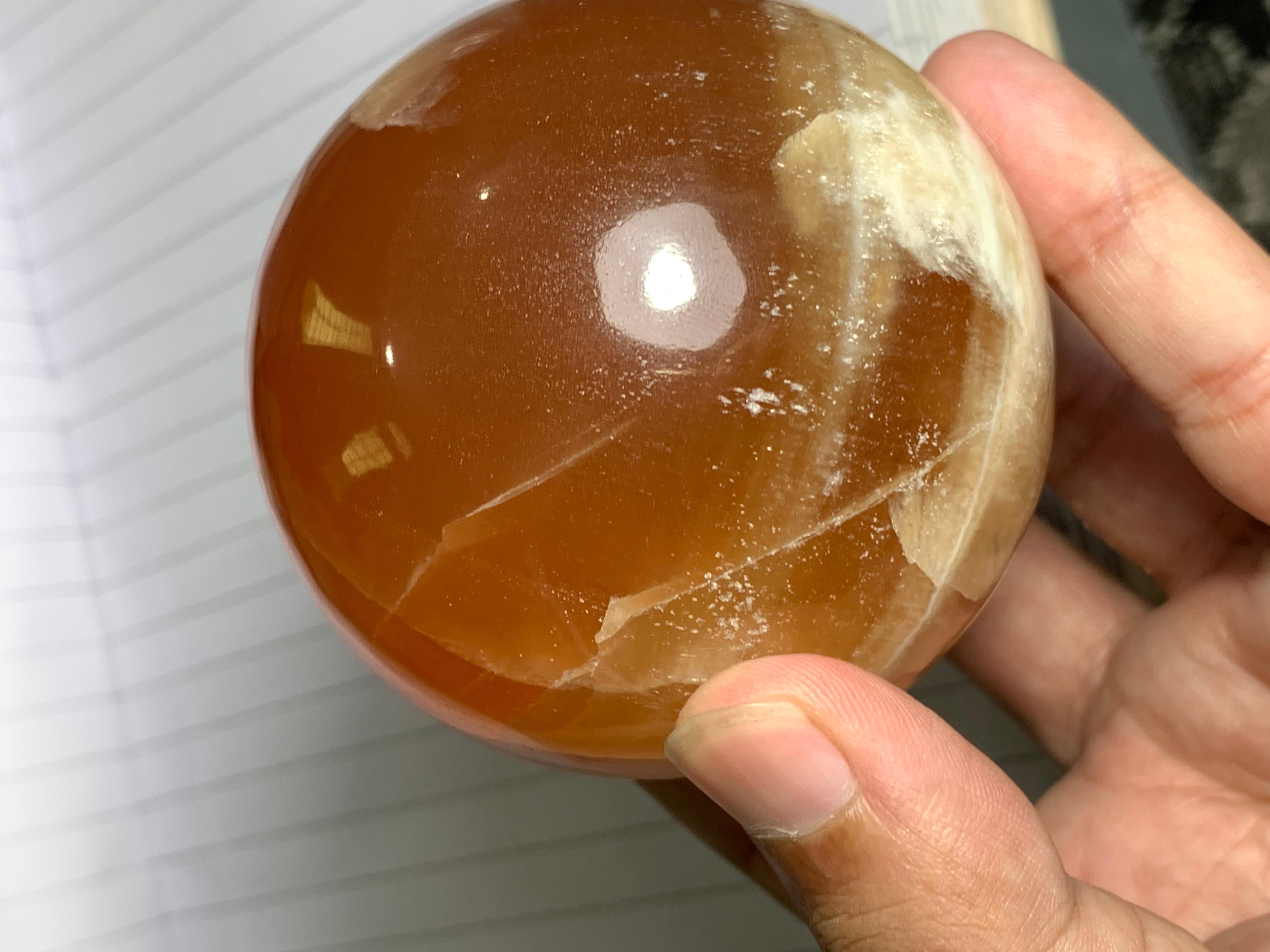 Contemporary Best Quality 548 Gram Red Honey Calcite Sphere For Sale