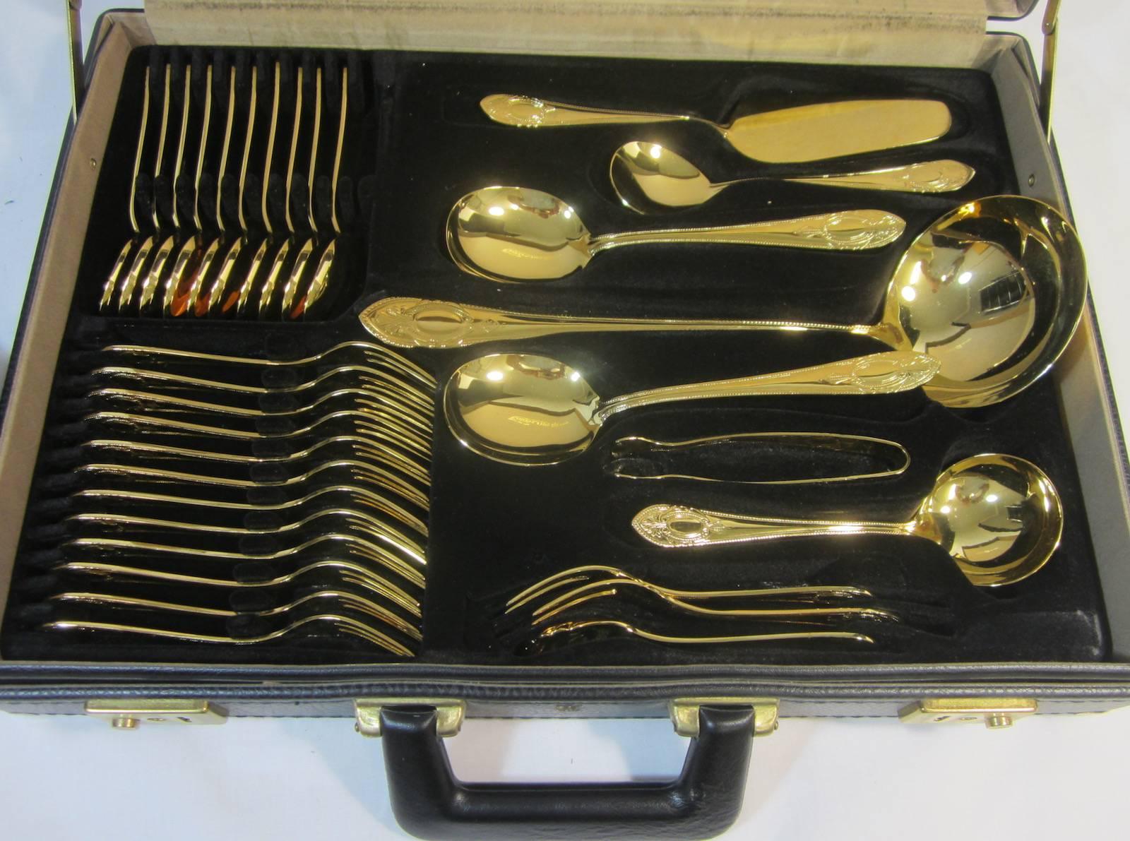 Bestecke Solingen German 23-24-Karat gold-plated 12 person cutlery set in a carry case with two layers.