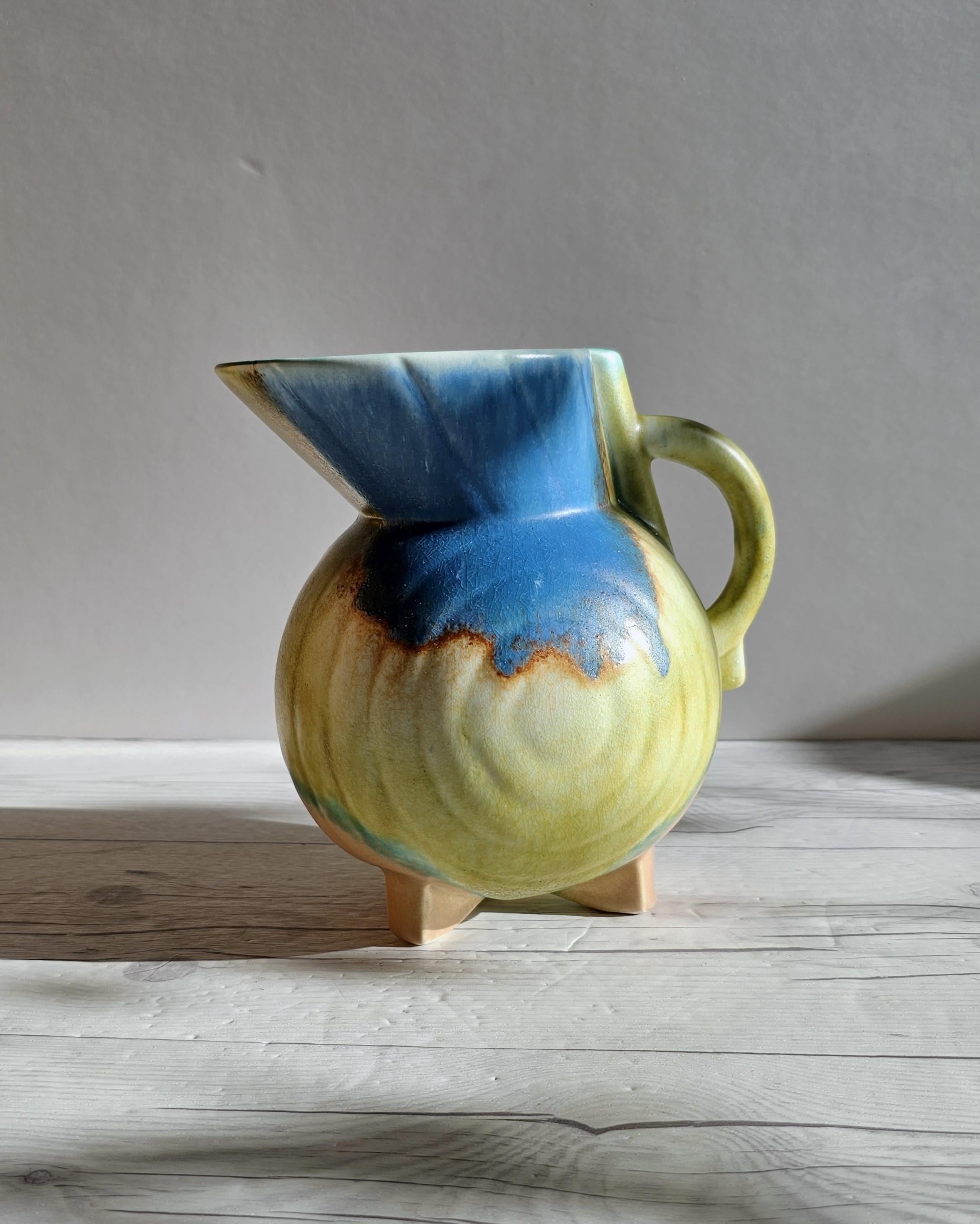 This subtly bold work of Art Deco design is British pottery Beswick. With strong curves that infer Streamline Moderne, the international style of Art Deco that emerged in the 1930s was inspired by aerodynamic design. The elevated and sharp