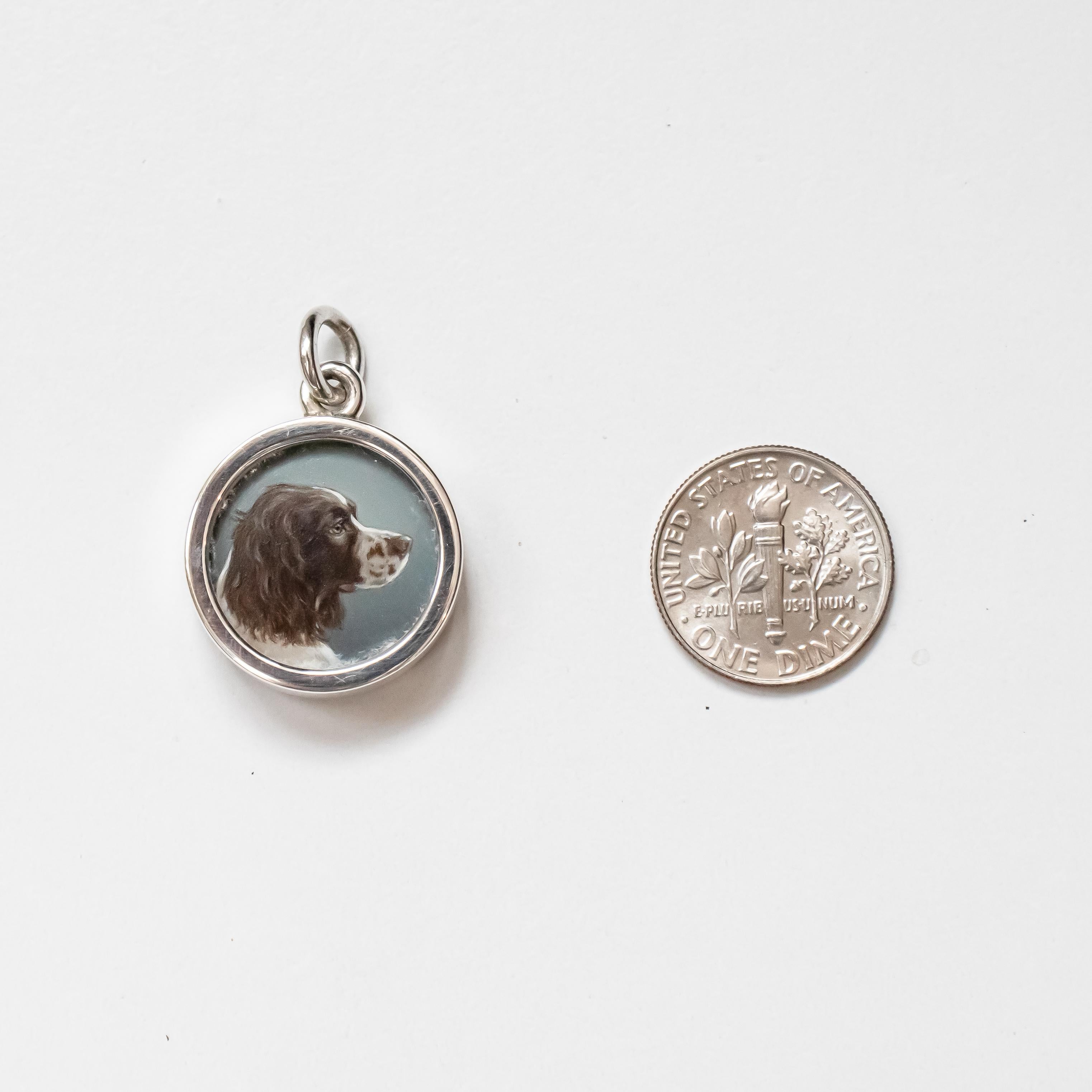 Original miniature oil painting on ivorine by esteemed miniaturist Beth de Loiselle (United States) of a Spaniel dog encased in a bespoke sterling silver ¾” charm by the master jewelry maker Paul Eaton VPRMS MAA (England) is a collectable, stunning