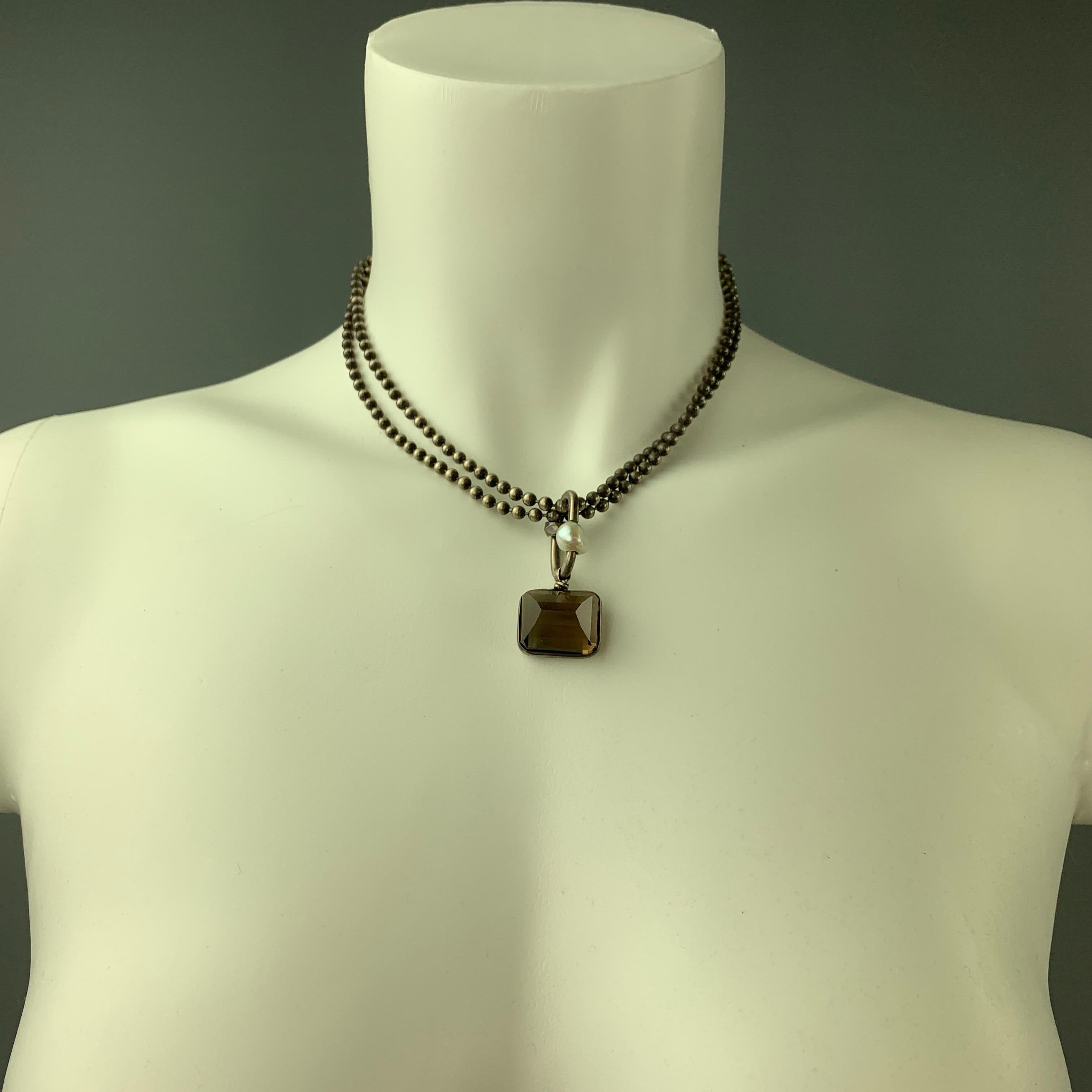 BETH ORDUNA necklace comes in a silver tone metal featuring a layered style, smokey quartz, and a clasp closure.

Very Good Pre-Owned Condition.

Measurements:

Length: 16.5 in.