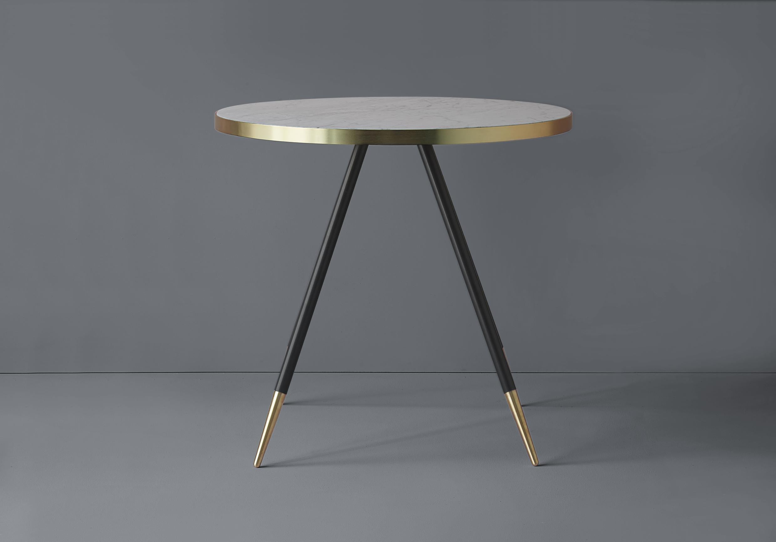 Bethan Gray has been inspired by pairing the natural beauty of coloured marble together with warm brushed brass to
create her Band range of tables. For this range, solid marble is encased in a warm and elegant metallic rim to bring a
distinctive,
