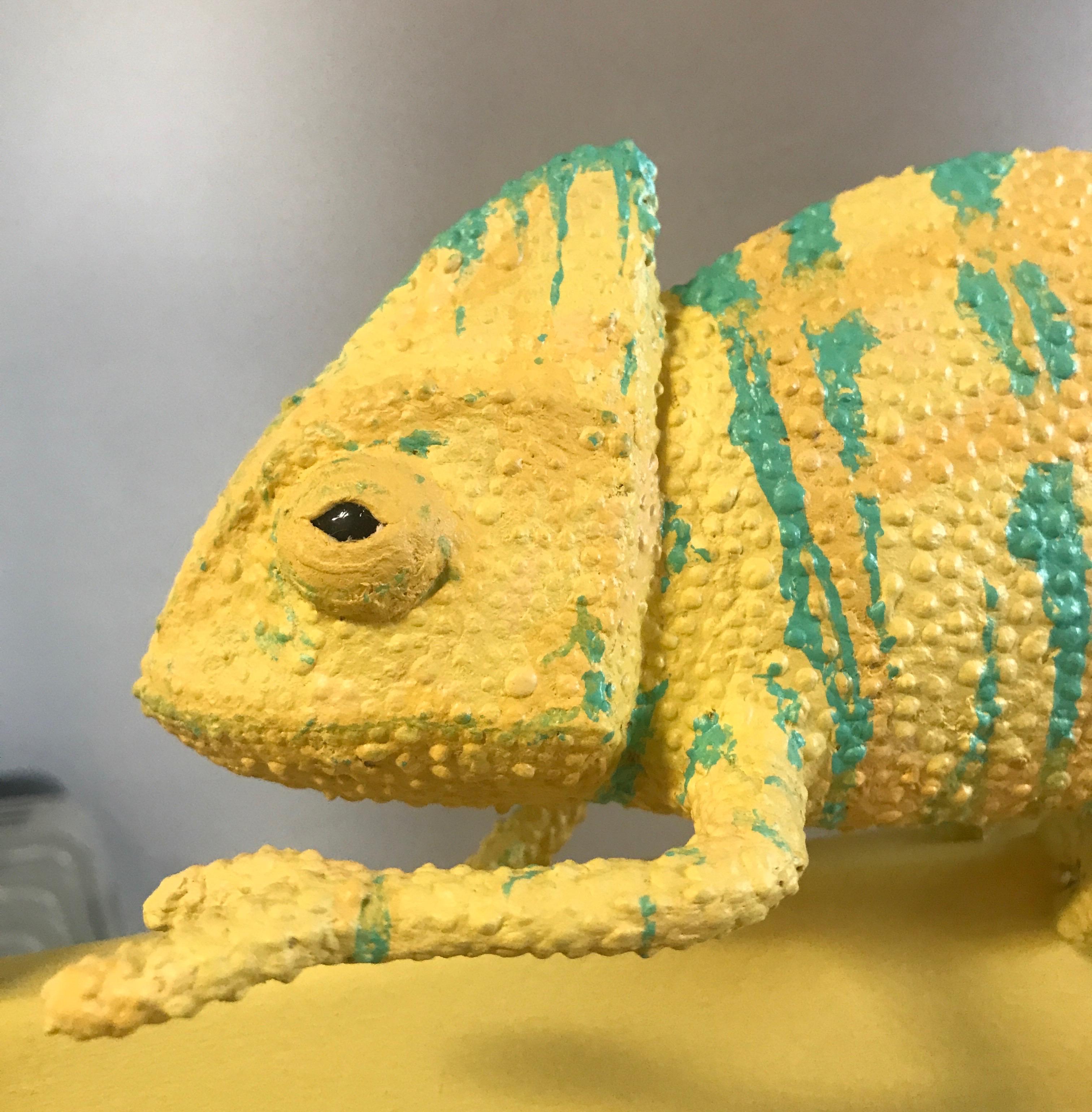 Paper Mache chameleon on a yellow chair 