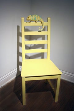 Paper Mache chameleon on a yellow chair "Tree-Dweller" by Bethany Krull