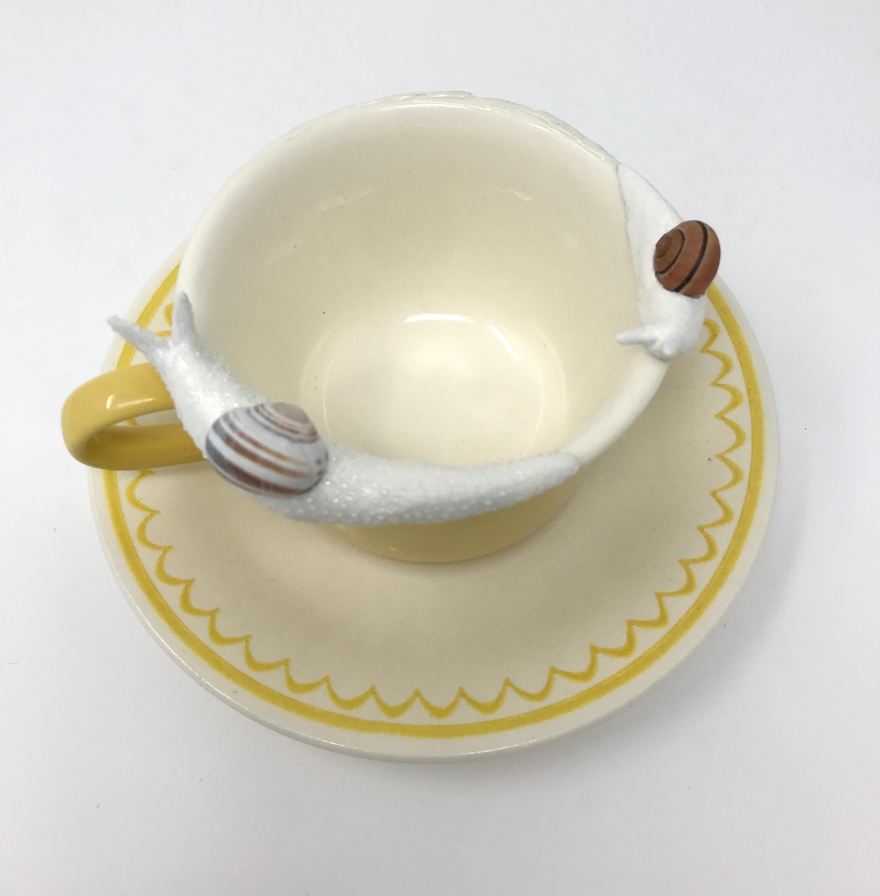 Snails on a yellow mug 