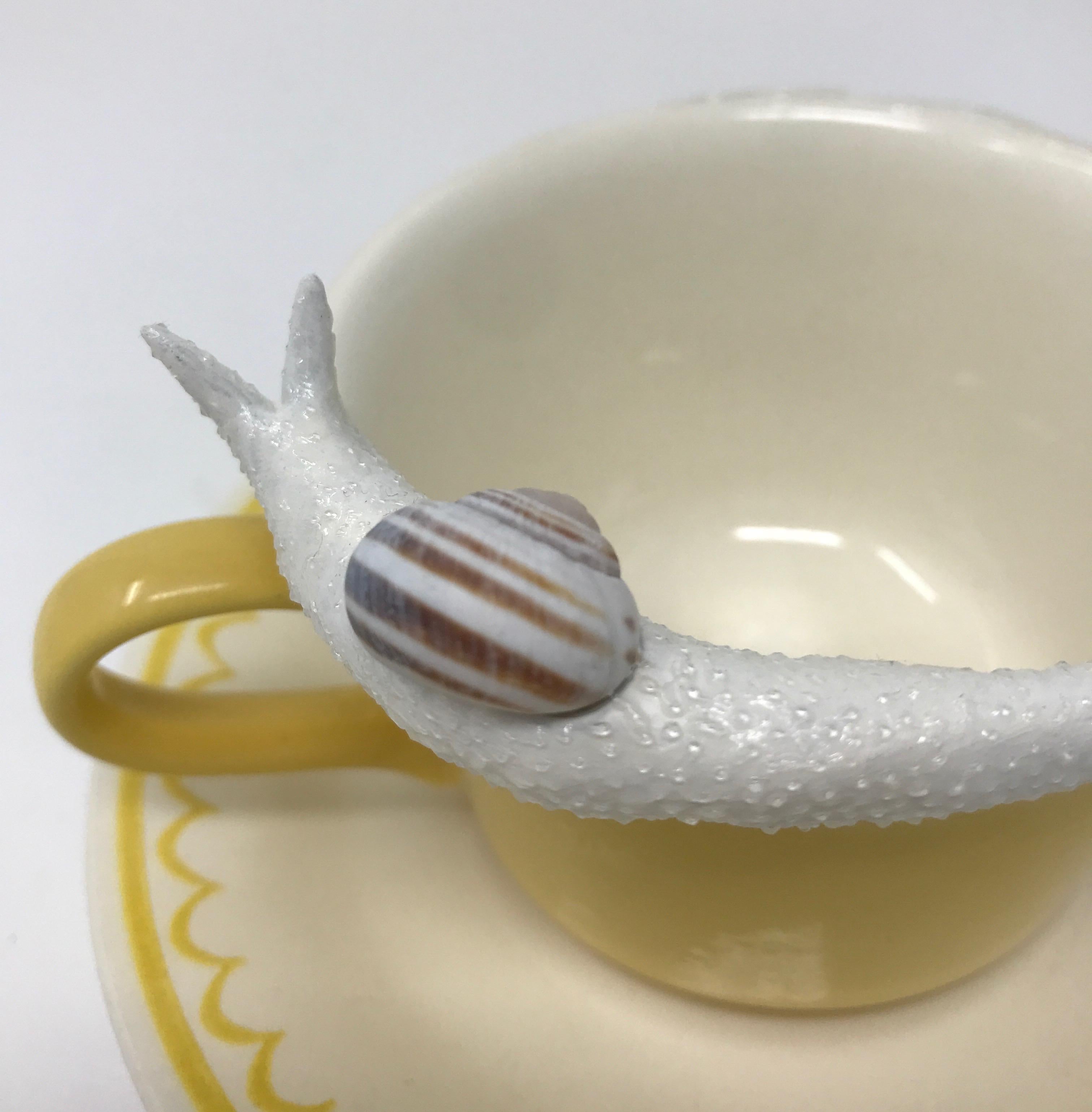 Snails on a yellow mug 