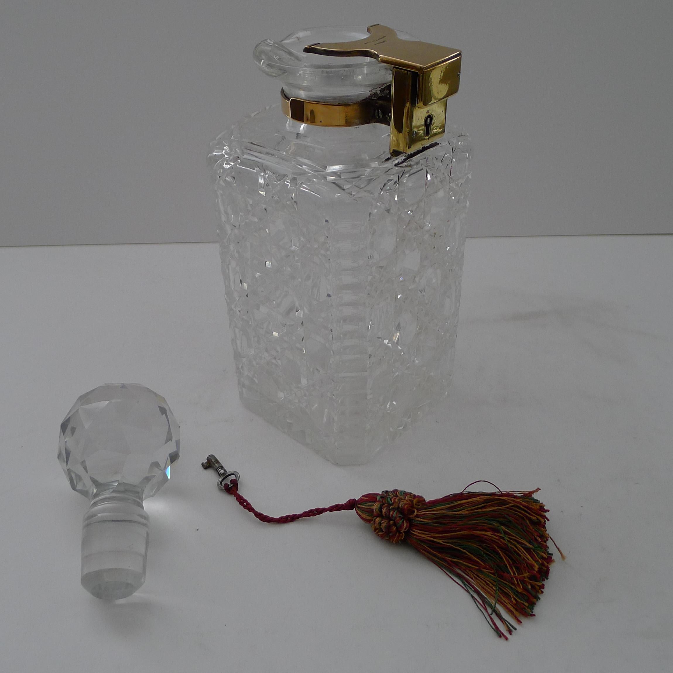 A stunning hefty cut glass decanter in the ever-popular hobnail design with cantered corners with a horizontal cut, the underside withe a star cut.

The neck incorporates a pouring spout and holds the original stopper.  The stopper is kept locked