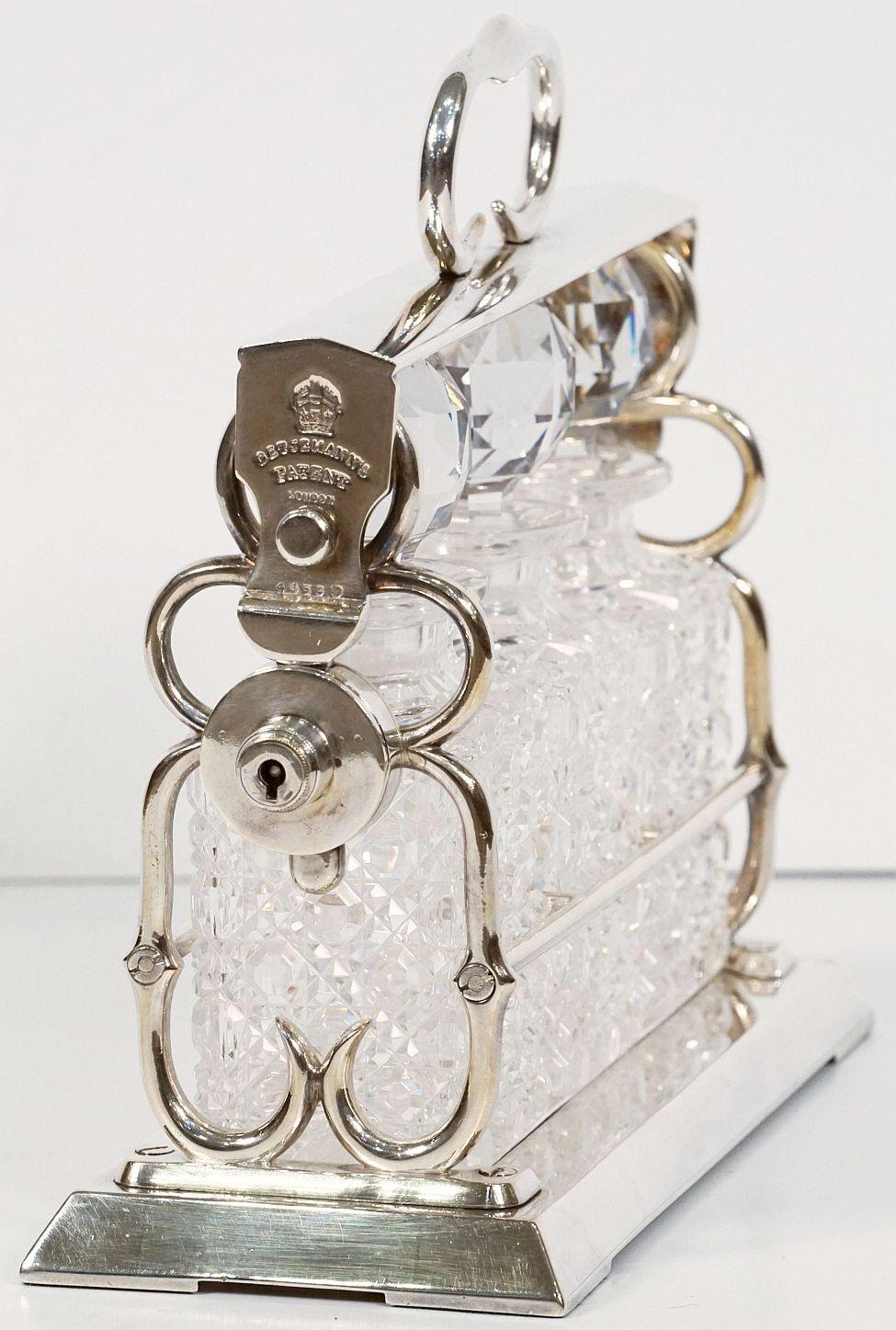 Edwardian Betjemann's Three-Bottle Tantalus with Original Hobnail Crystal Decanters