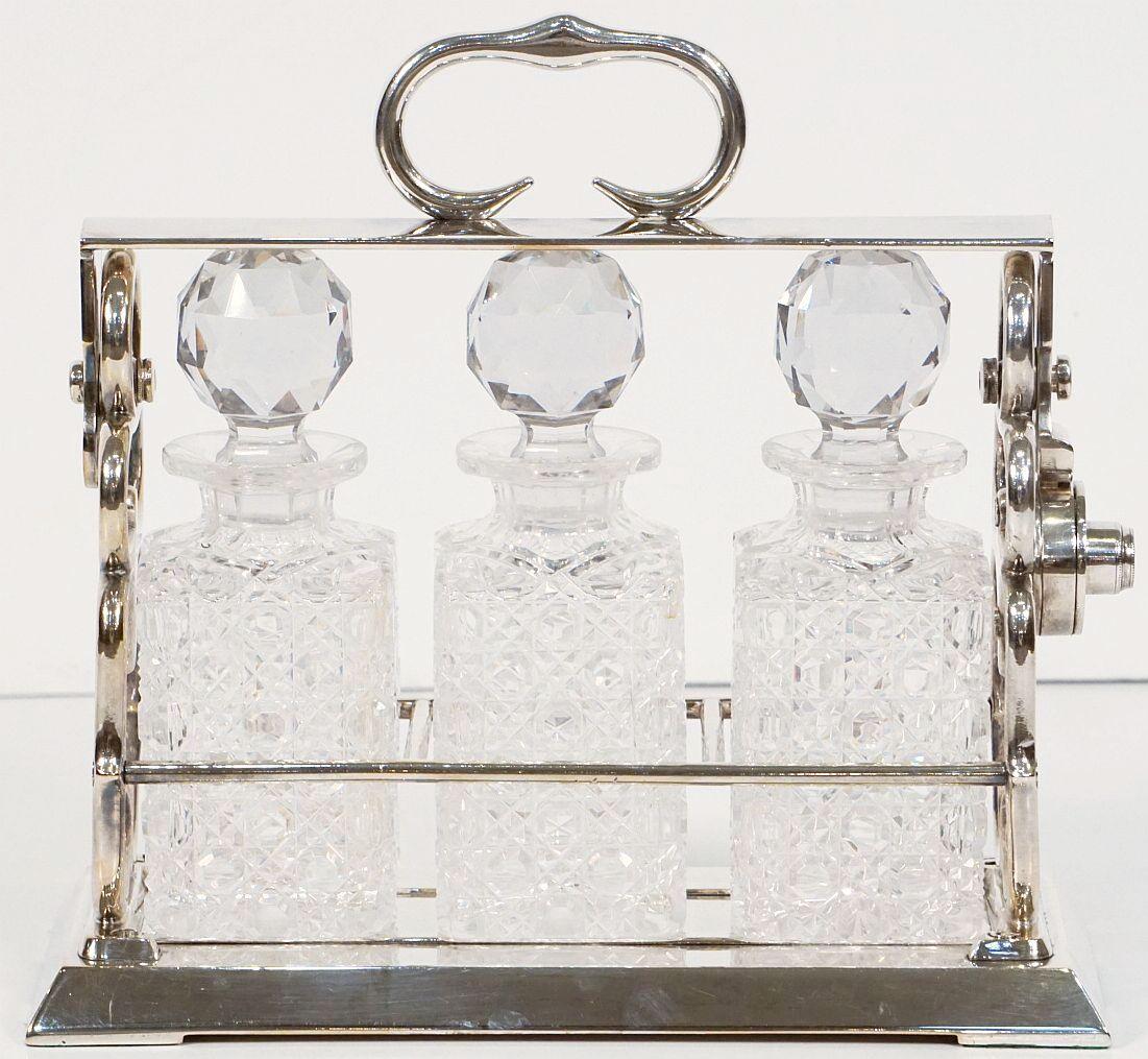 English Betjemann's Three-Bottle Tantalus with Original Hobnail Crystal Decanters