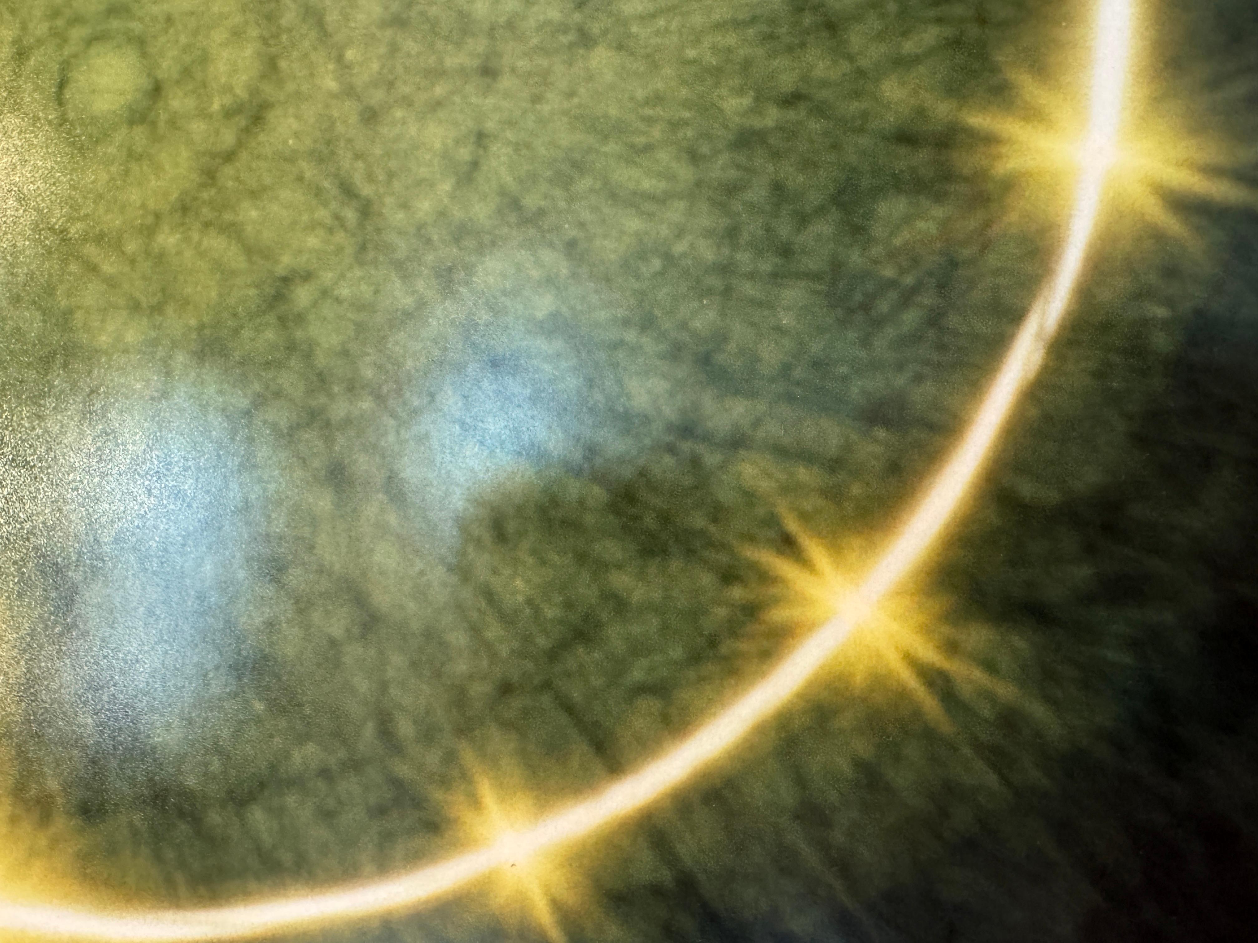 This chromogenic chemical photograph of the sun is mounted onto plexiglass with hanging mechanism on the back. Artist Betsy Kenyon took this image during the Winter, Solar Maximum, 2025, single-broken, with flares. This is a limited edition print #1