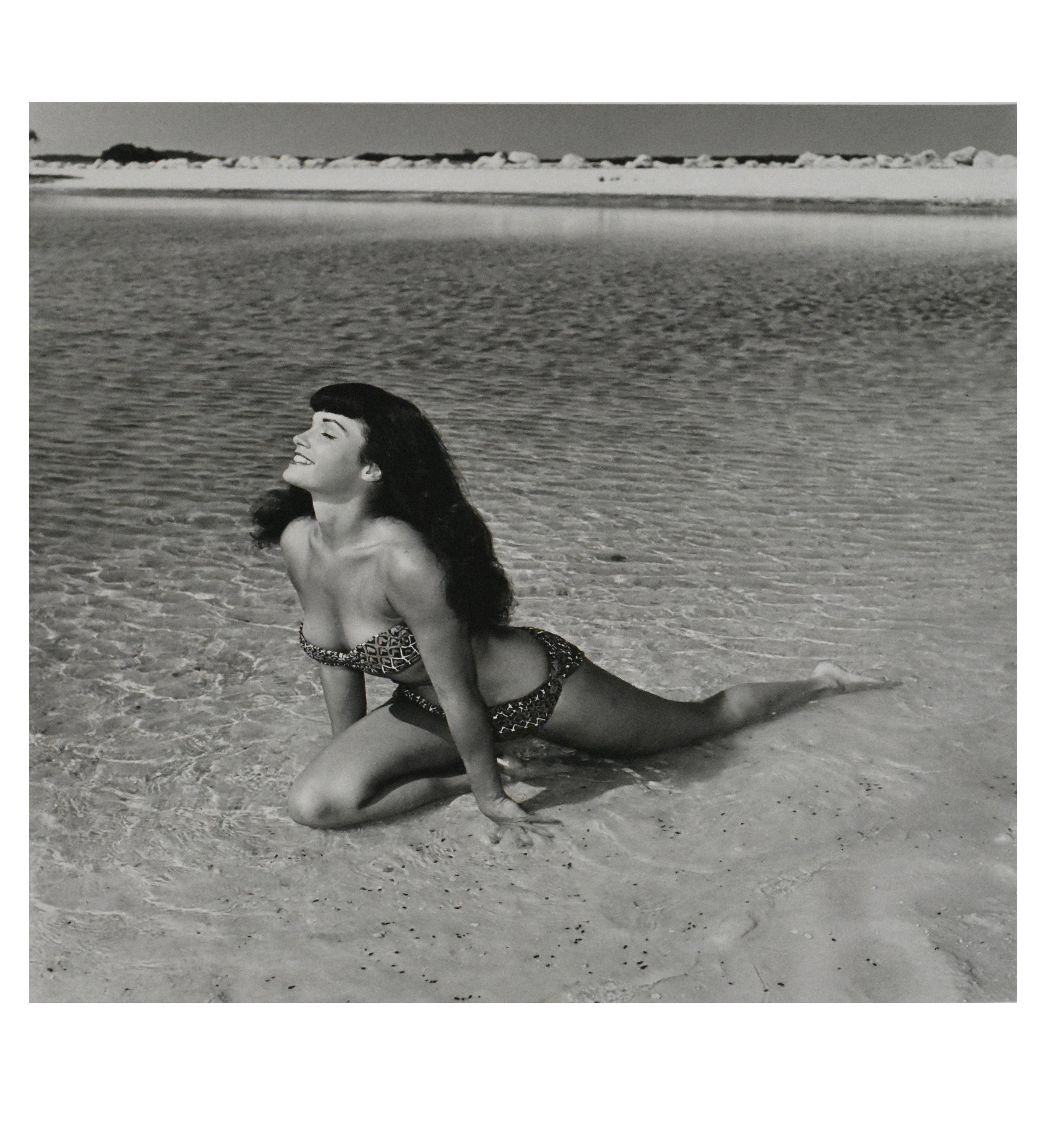 Bettie Page 'Kneeling in Surf', Key Biscayne, Florida, 1954 by Bunny Yeager
Photographed in 1954
Printed in 2013
Gelatin Silver Print
Image size: 19 in. H x 18.75 in. W
Sheet size: 24 in. H x 20 in. W
Frame size: 26.5 in. H x 31 in. W
Artist