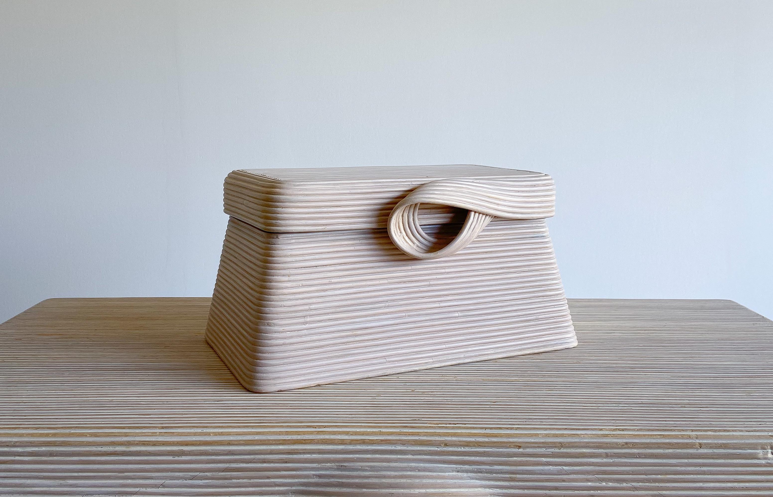 Offered is a lovely sculptural split reed decorative box designed by Betty Cobonpue for her 