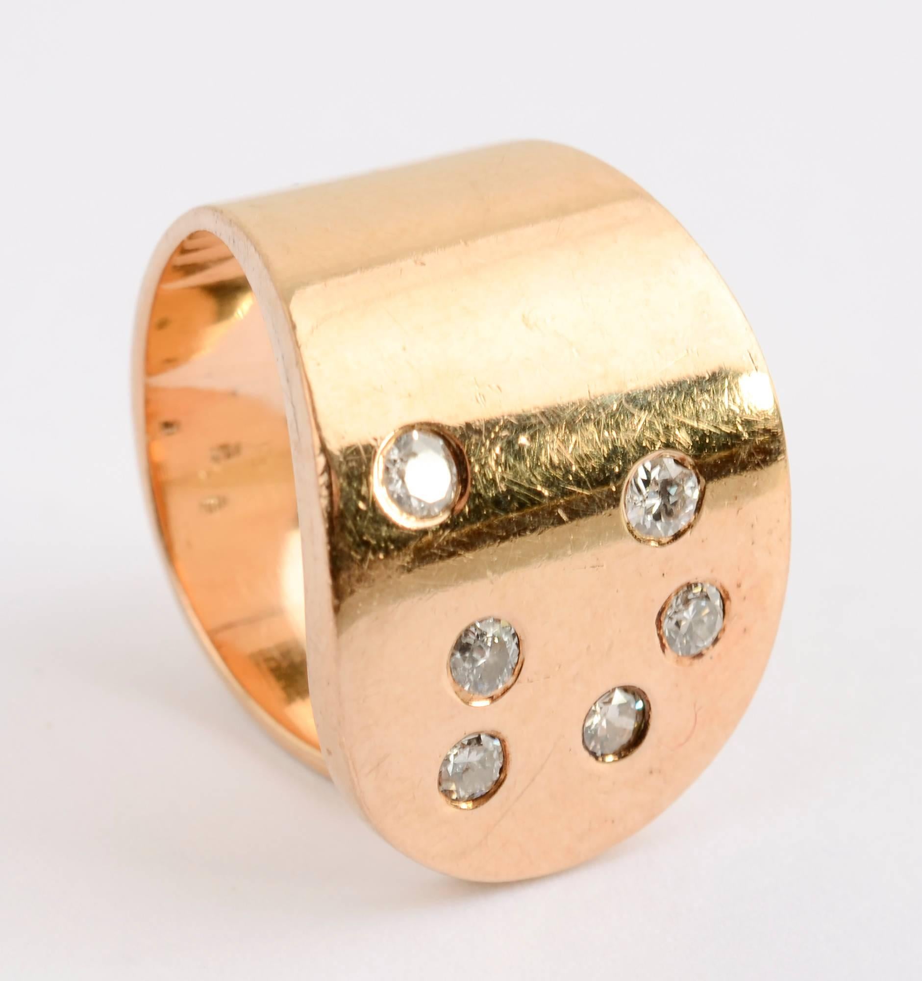 Custom made gold ring by modernist jeweler, Betty Cooke. The 14 karat gold ring has six diamonds. It is made as an open circle that is size 5 1/2 but can easily be modified to a smaller or larger size. The front of the ring is 5/8