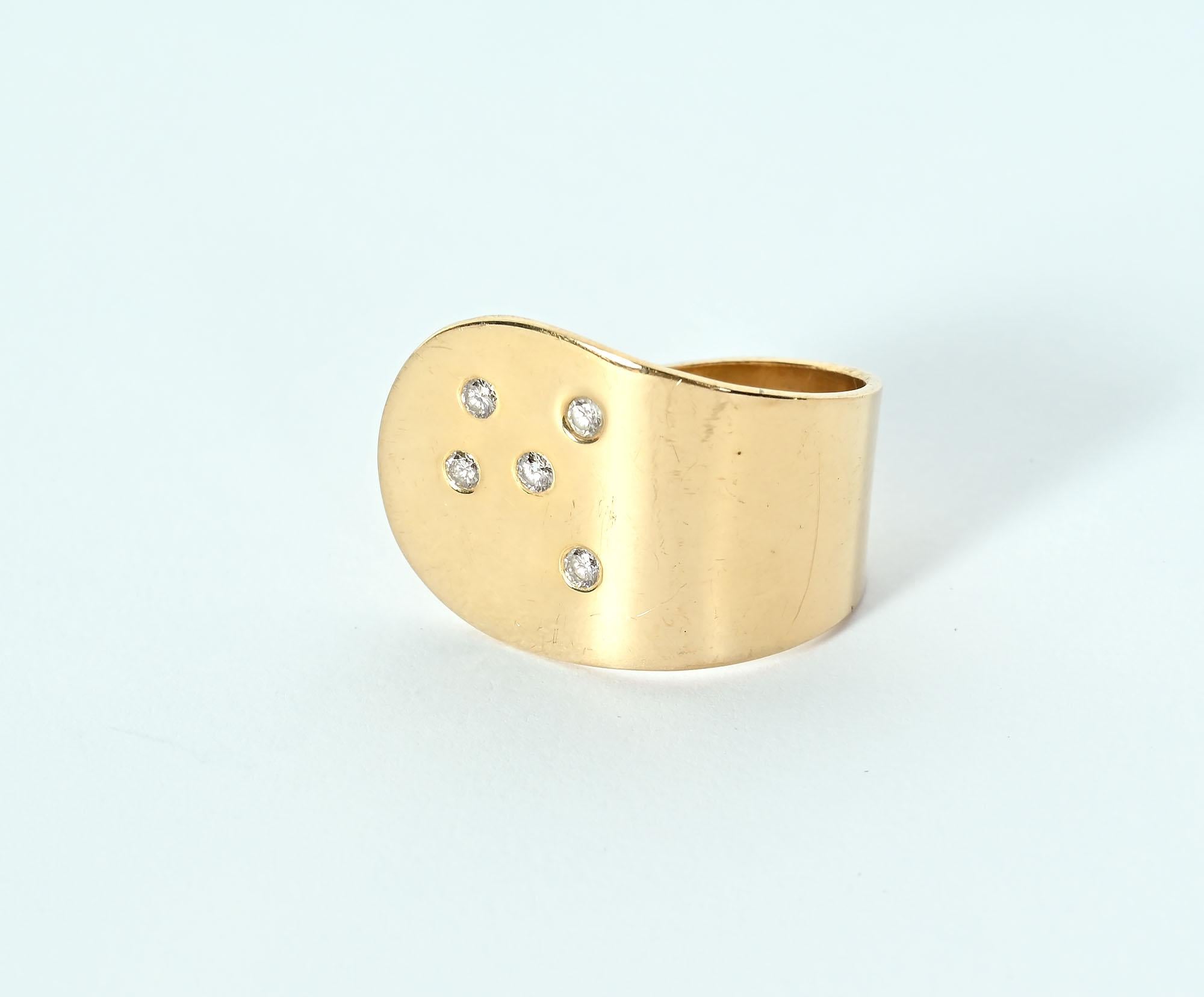 Betty Cooke open circle 14 karat gold ring with five diamonds. The ring is currently size 6 1/2 but because the circle is open, it can easily be modified to any size larger or smaller. The front of the  ring is 3/4