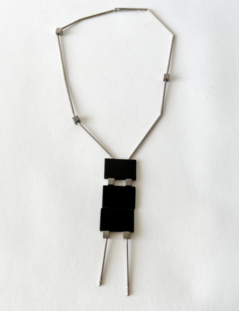 Black onyx plaques threaded on sterling silver chain with tubes, created by Betty Cooke of Baltimore, Maryland. Sterling tube necklace portion measures 19