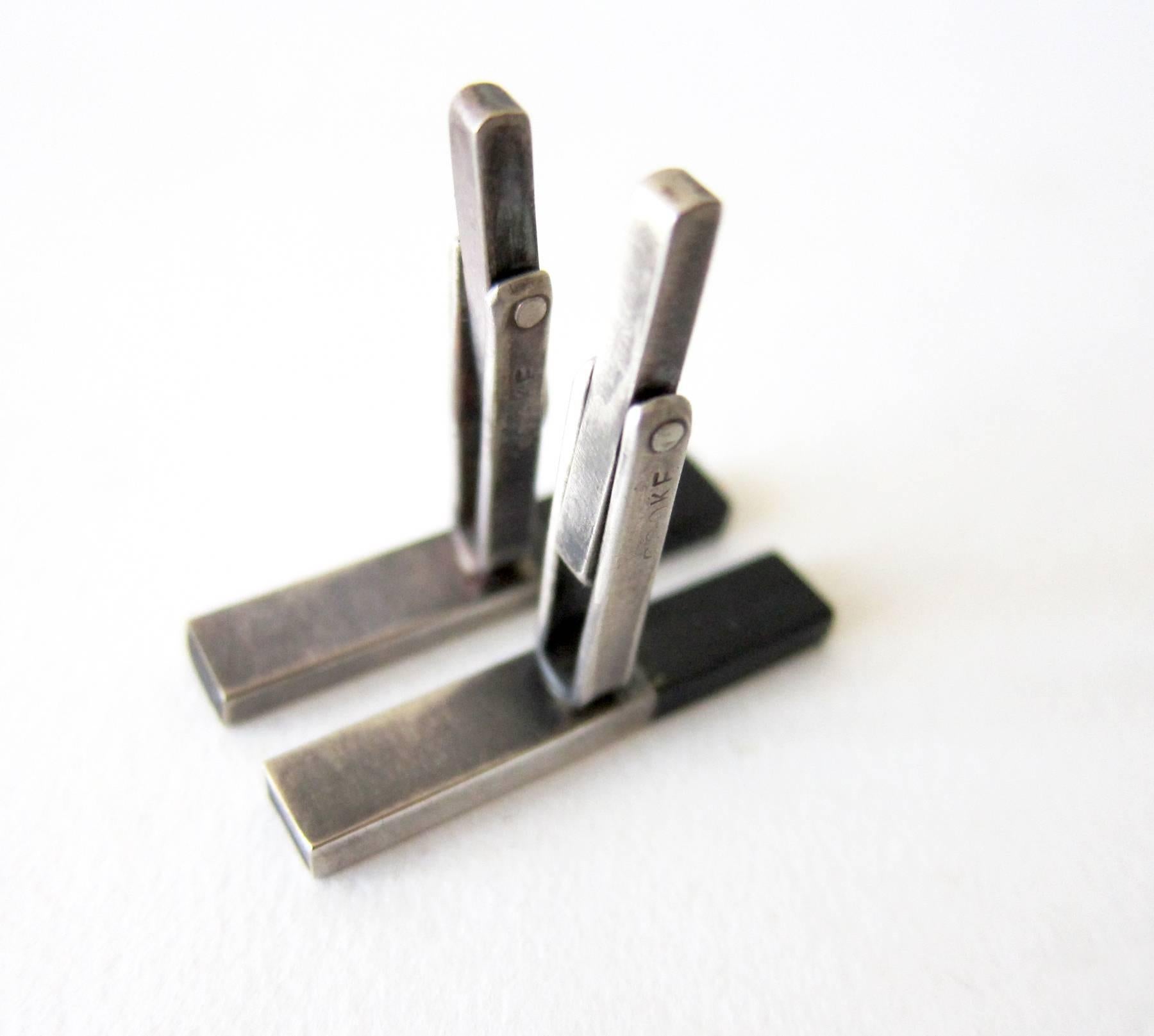 Mid century modernist sterling silver and exotic ebony wood cufflinks created by Betty Cooke of Baltimore, Maryland.  Cufflinks measure 1.25