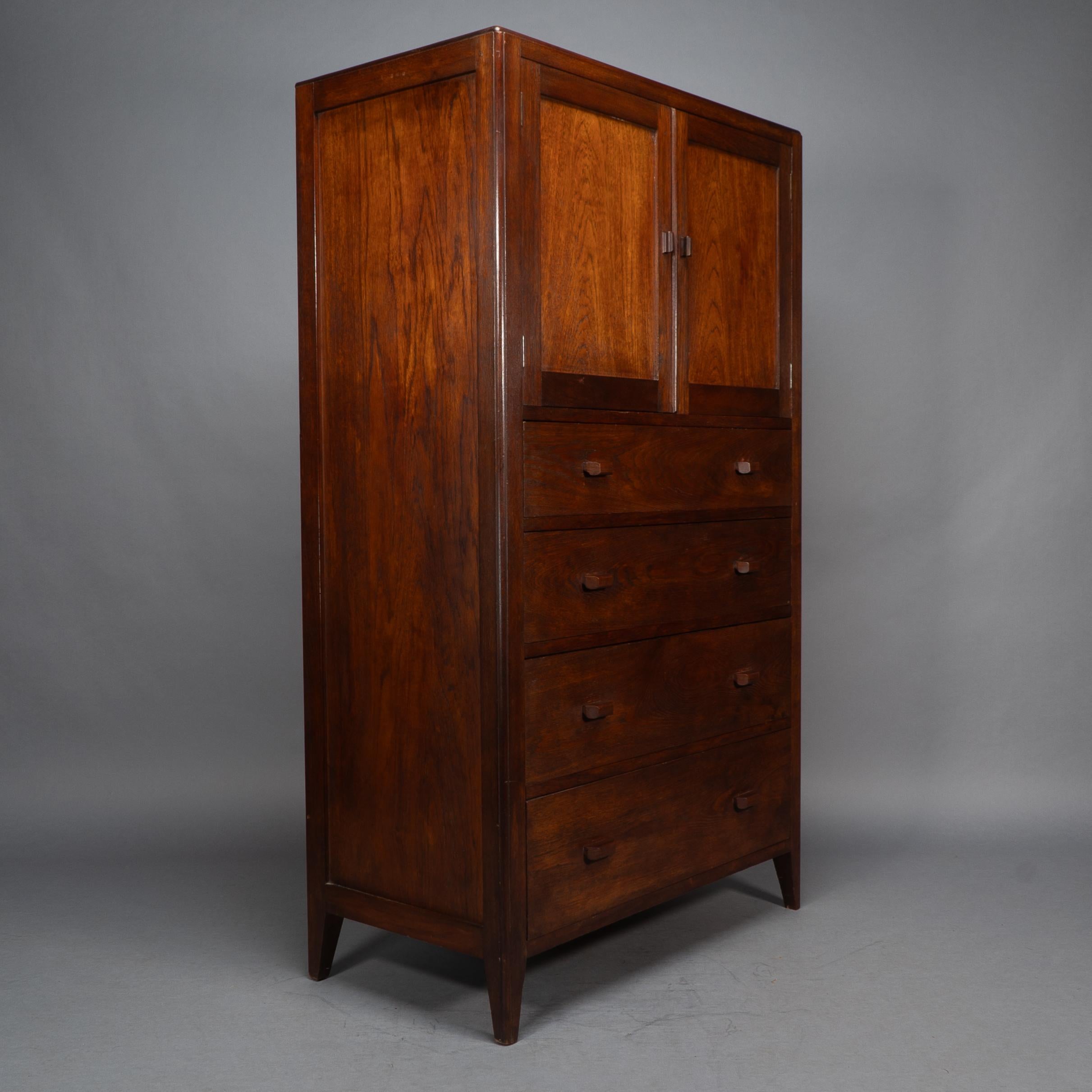 Betty Joel, attributed, an Arts & Crafts oak tallboy and matching petite chest of drawers with hand crafted handles and angled feet.
Tall boy measures H 62 1/2