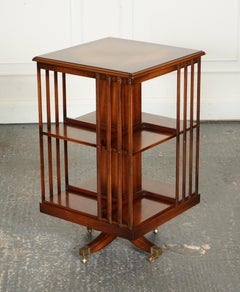 BEVAN FUNNEL REVOLVING BOOKCASE END TABLE RAiSED ON BRASS CASTORS