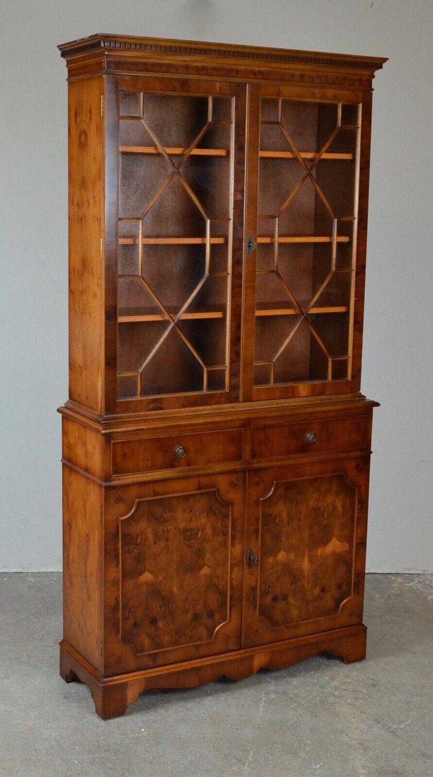 We are delighted to offer for sale this lovely antique Bevan Funnell LTD glazed mahogany bookcase. 

Well made in the 20th century, it has dental-style molding below the cornice, astral-glazed doors on the top section, two drawers in between, and