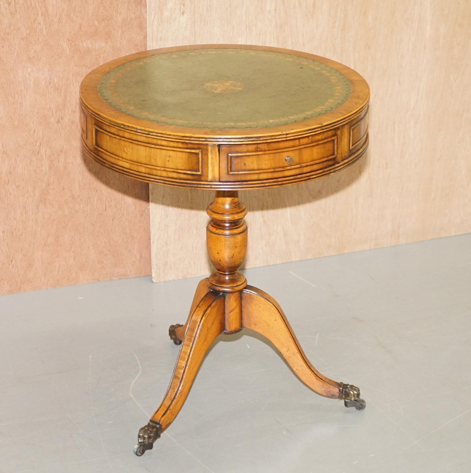We are delighted to this lovely Bevan Funnell burr yew with green leather gold leaf tooled top, Regency style side drum table 

A very good looking and well-made piece, the leather top is gold leaf embossed, the table has three nice sized drawers