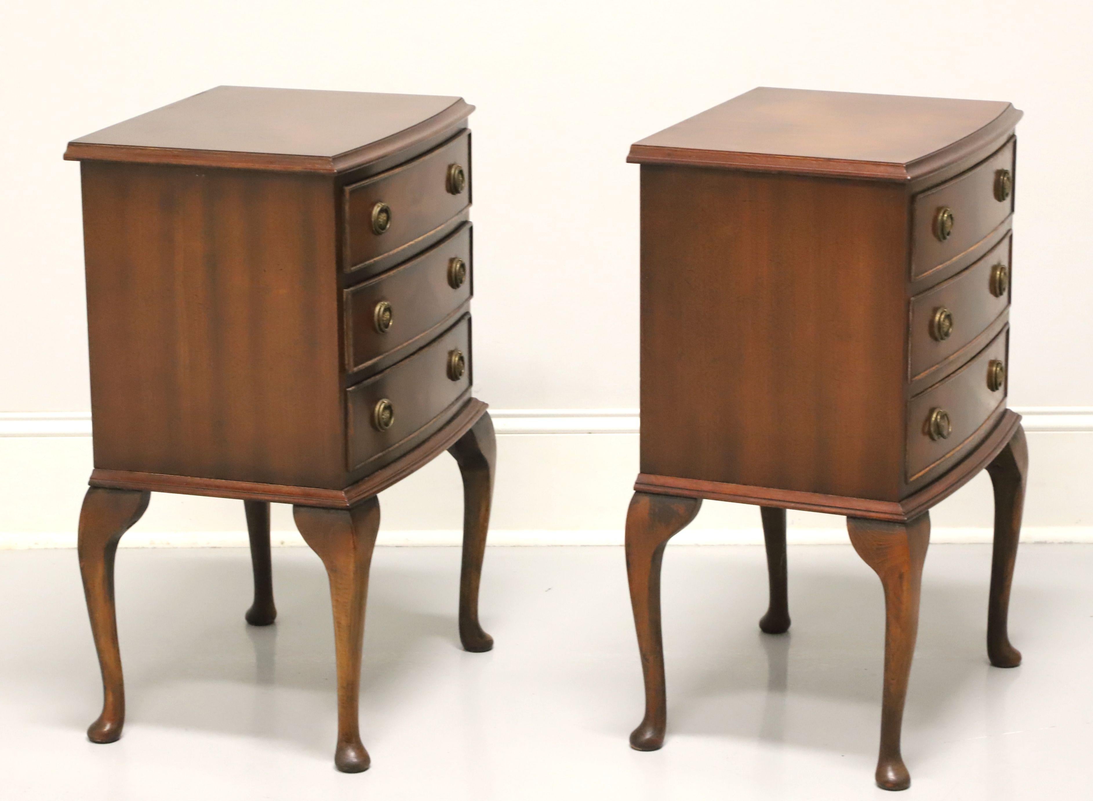 A pair of Georgian style side tables by Bevan Funnell. Mahogany with flame mahogany drawer fronts, brass hardware, cabriole legs and pad feet. Features three drawers of dovetail construction. Made in England, in the mid 20th century.

Measures: