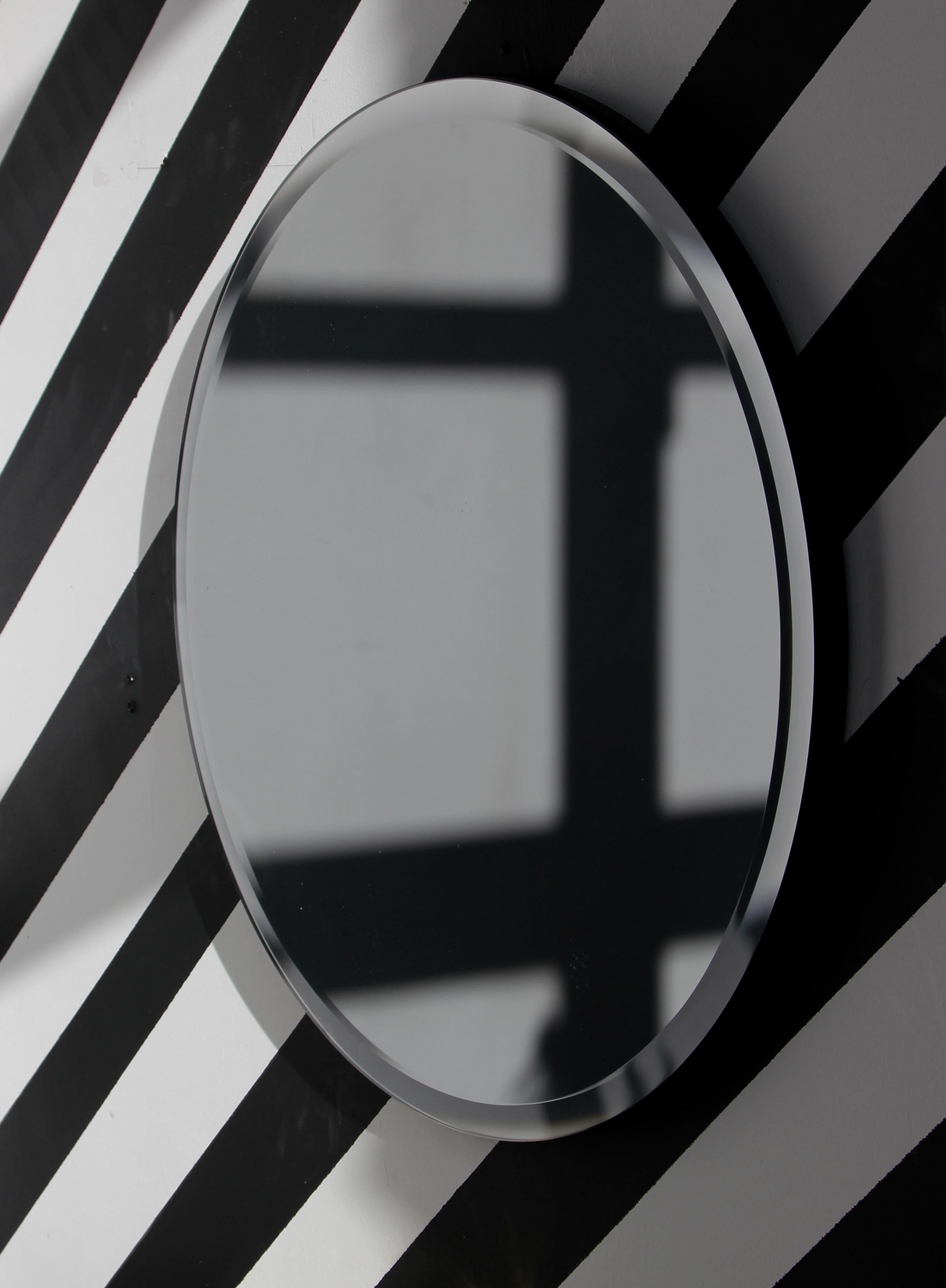 Beveled Orbis Bevelled Black Tinted Round Frameless Mirror Faux Leather Backing, Large For Sale