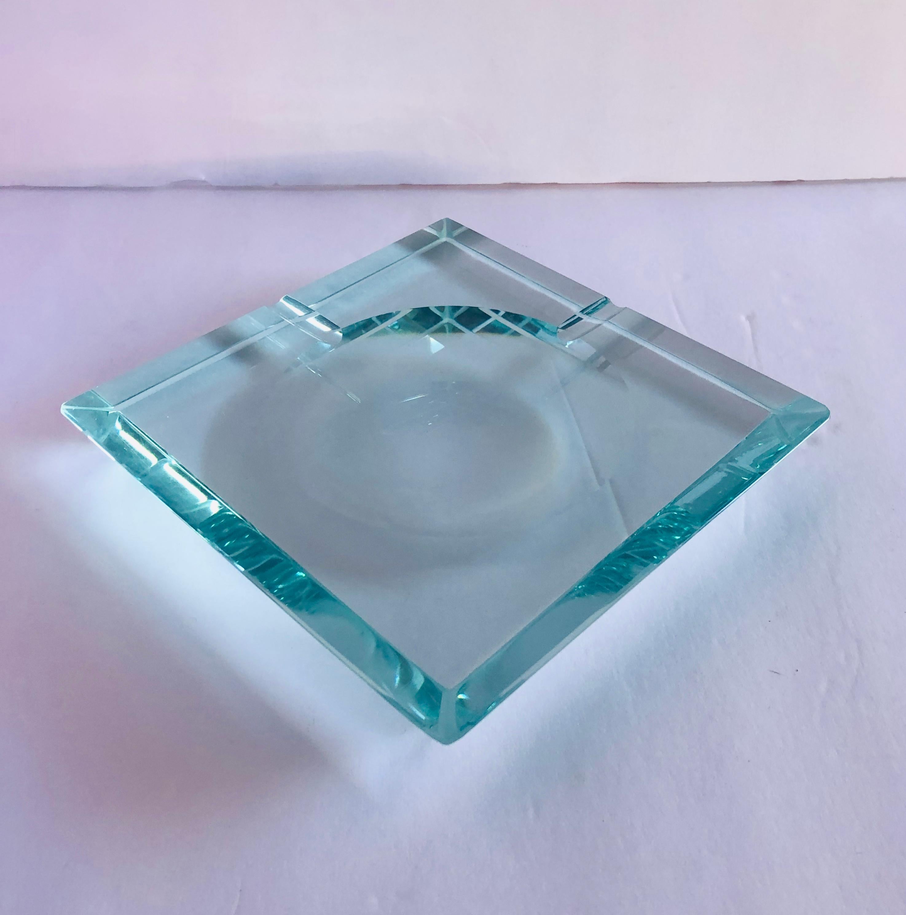 Vintage Italian beveled glass ashtray by Fontana Arte / Made in Italy circa 1960s
Measures: Length 6.5 inches / width 6.5 inches / height 1 inch
1 in stock in Palm Springs ON 20% OFF SALE for $792 !!!
Order Reference: FABIOLTD G77
This piece makes