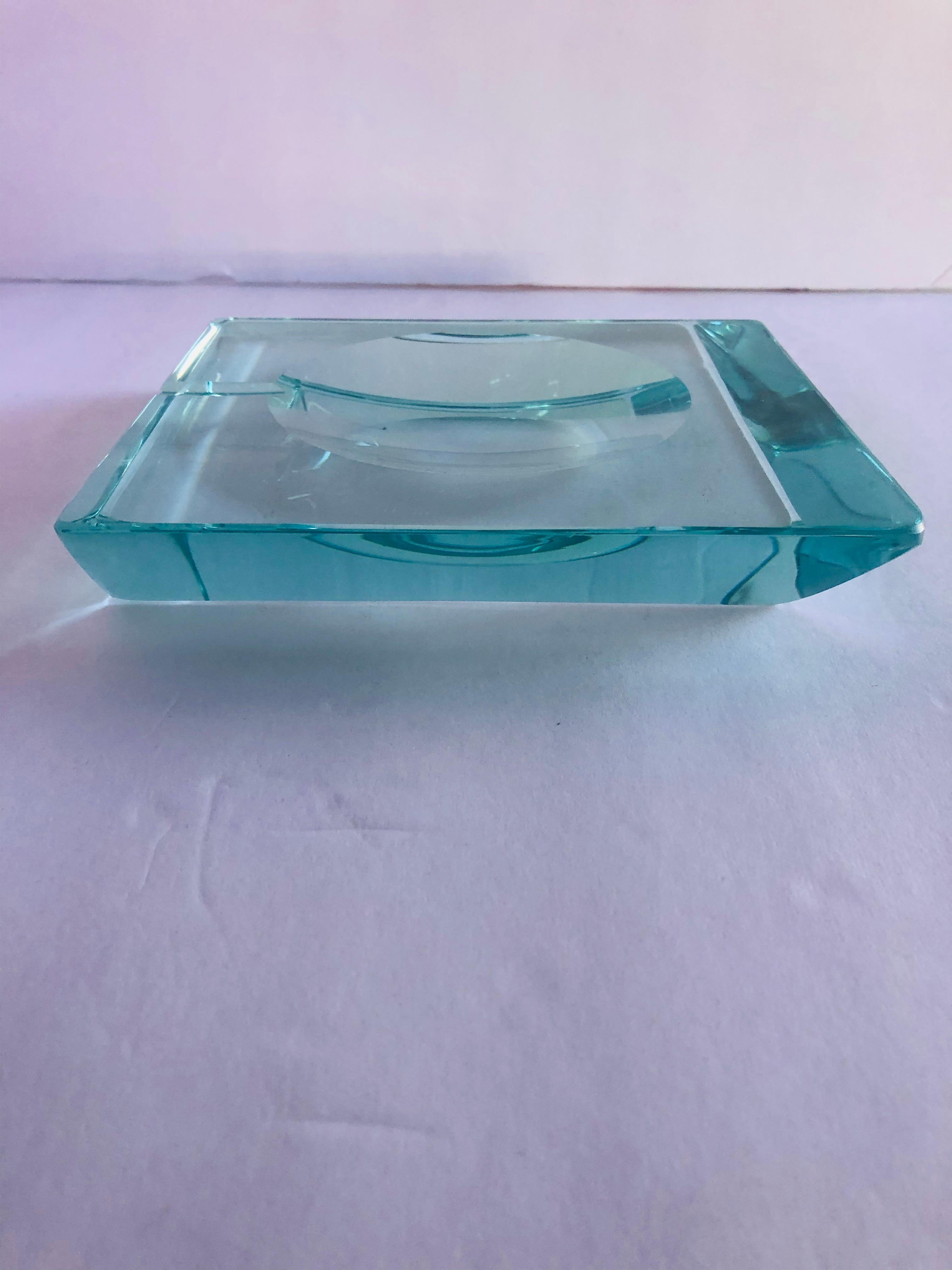 Vintage Italian beveled glass ashtray by Fontana Arte / Made in Italy circa 1960s
Measures: Length 6.75 inches, width 6.75 inches, height 1.25 inches
1 in stock in Palm Springs ON 20% OFF SALE for $792 !!!
Order Reference: FABIOLTD G79
This piece