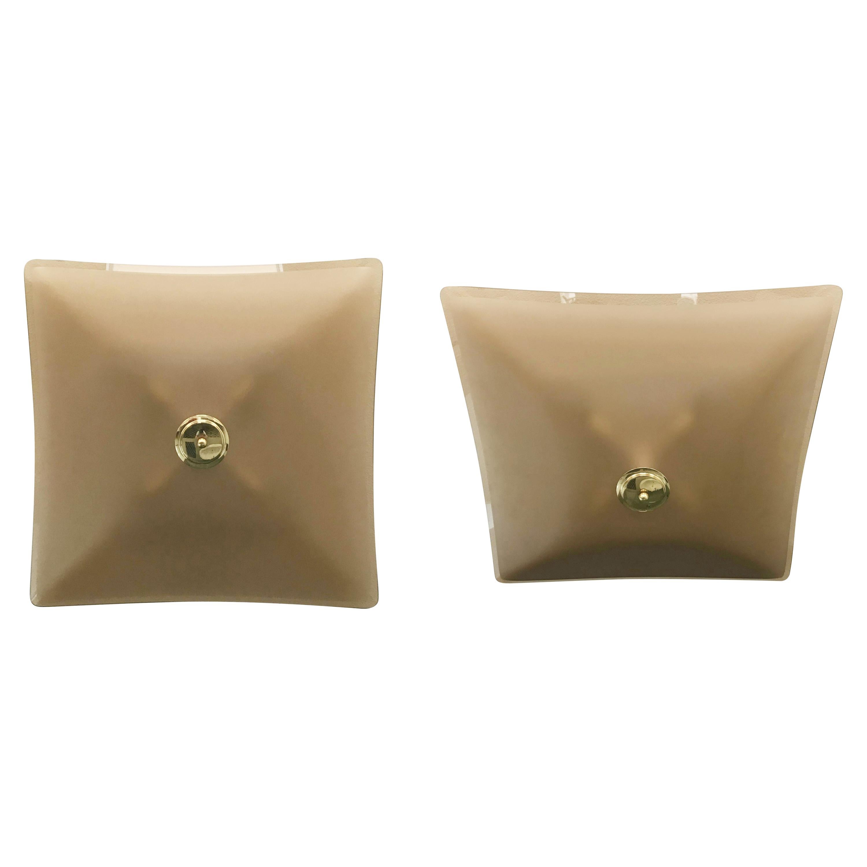 Elegant Italian flush mount or wall sconce, composed of single smoky colored glass diffusers with beveled edge and satin center, mounted with brass finials on painted white back plates / Made in Italy, circa 1960s.
4 lights / E12 or E14 type / max