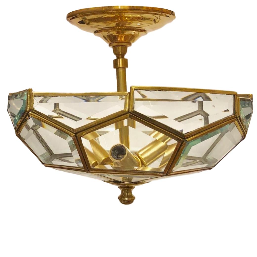 A Italian semi-flush mount pendant fixture with beveled glass insets, circa 1960s.

Measures:
Drop 9