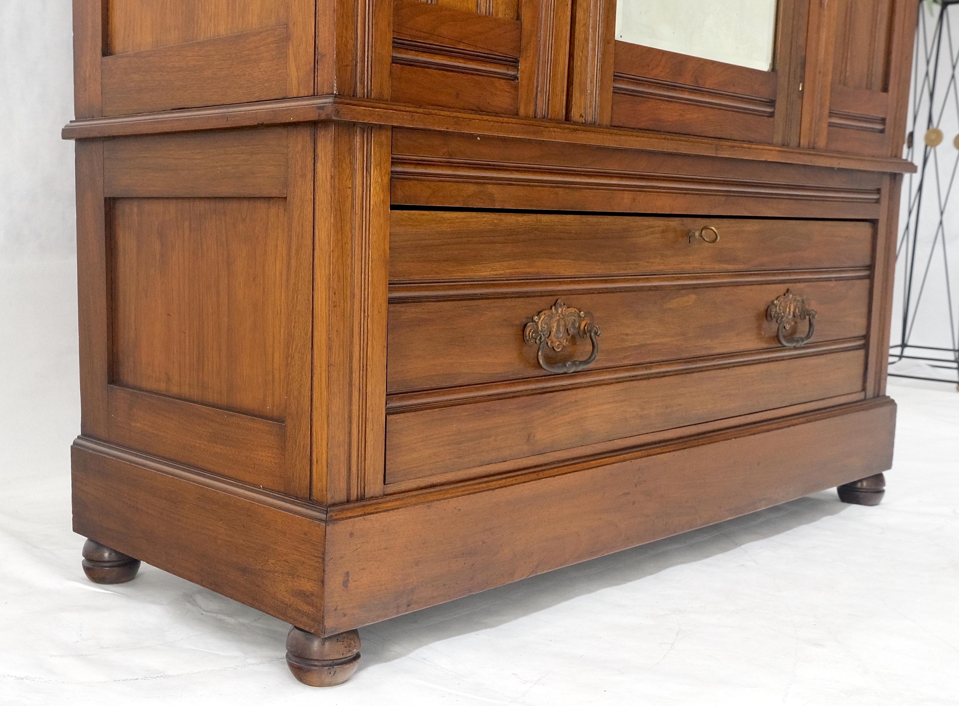 Beveled Mirror Door Fine Carved Plaques Bottom Drawer Victorian Walnut Wardrobe In Good Condition In Rockaway, NJ