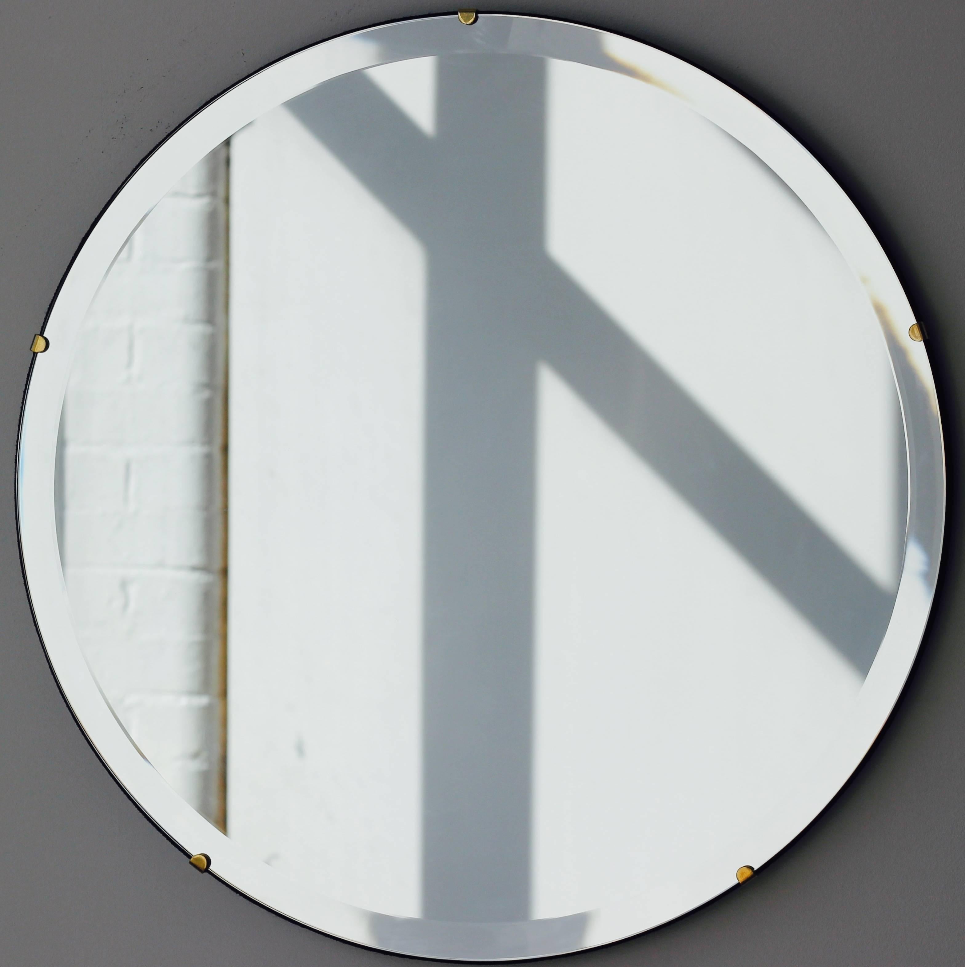Art Deco Orbis™ round mirror frameless with an elegant bevel, velvet backing and optional brass clips. Designed and handcrafted in London, UK.

Our mirrors are designed with an integrated French cleat (split batten) system that ensures the mirror is