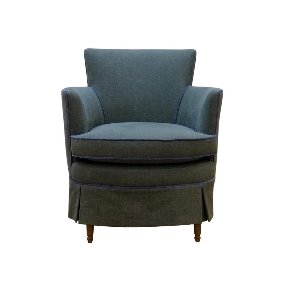 The Beverly Chair brings timeless charm and tailored comfort to smaller spaces. Its soft, rounded silhouette and delicate piping reflect classic elegance, while the plush cushioning invites you to settle in. Subtly elevated by rounded wood legs and