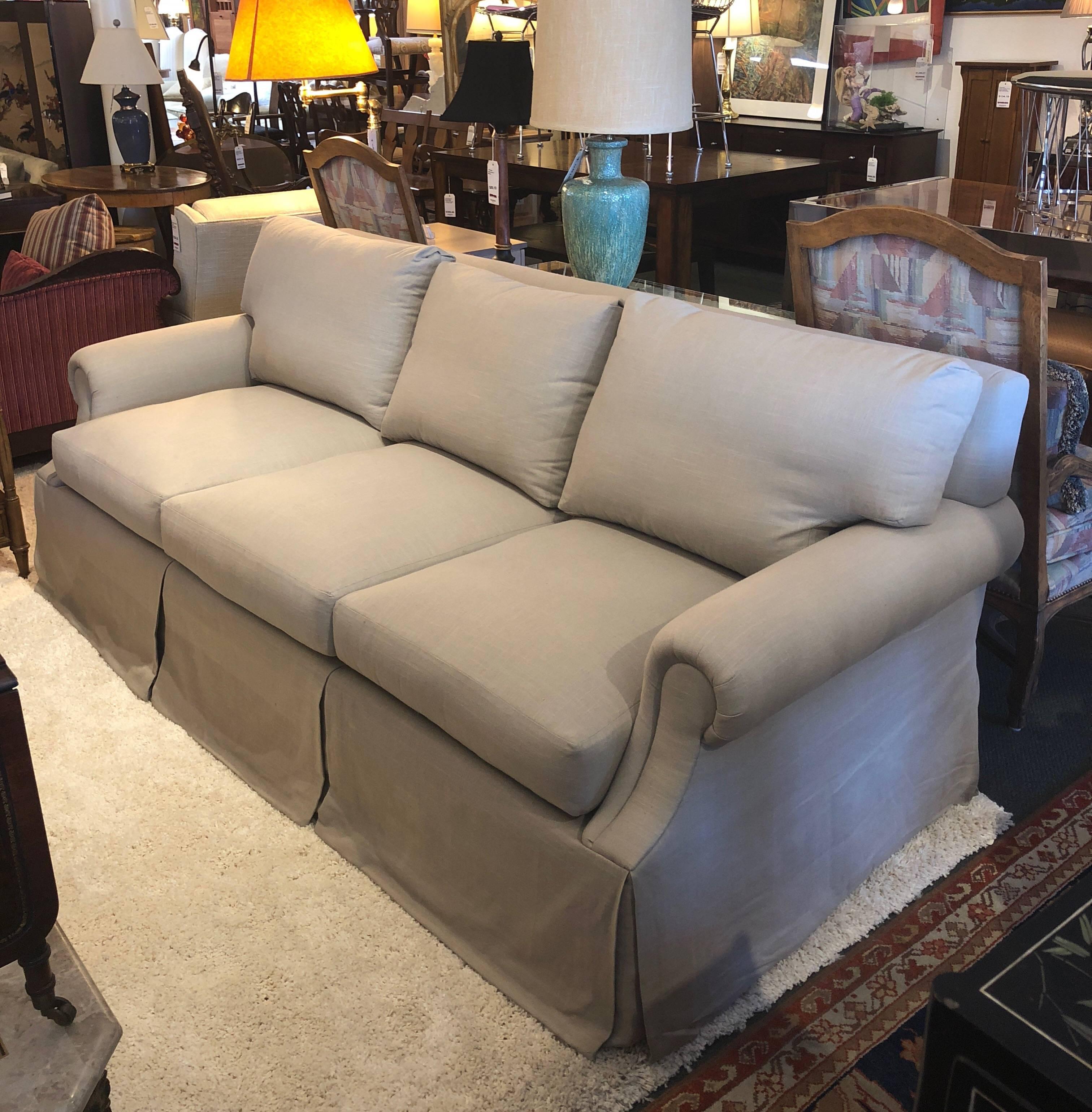 A new Flintridge sofa from Beverly. This showroom sample is elegant and simple, with a neutral beige textured upholstery, feather and down back cushions and down wrapped seat cushions.

