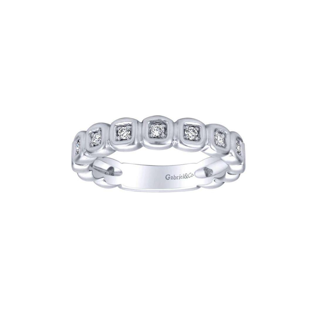 Organic bezel set design with satin finish diamond band in 14k white gold. Band contains 0.08 ctw of fine white round brilliant cut diamonds, H color, SI clarity. Band is suitable as a one of a kind wedding band, a fashion ring, anniversary ring, or