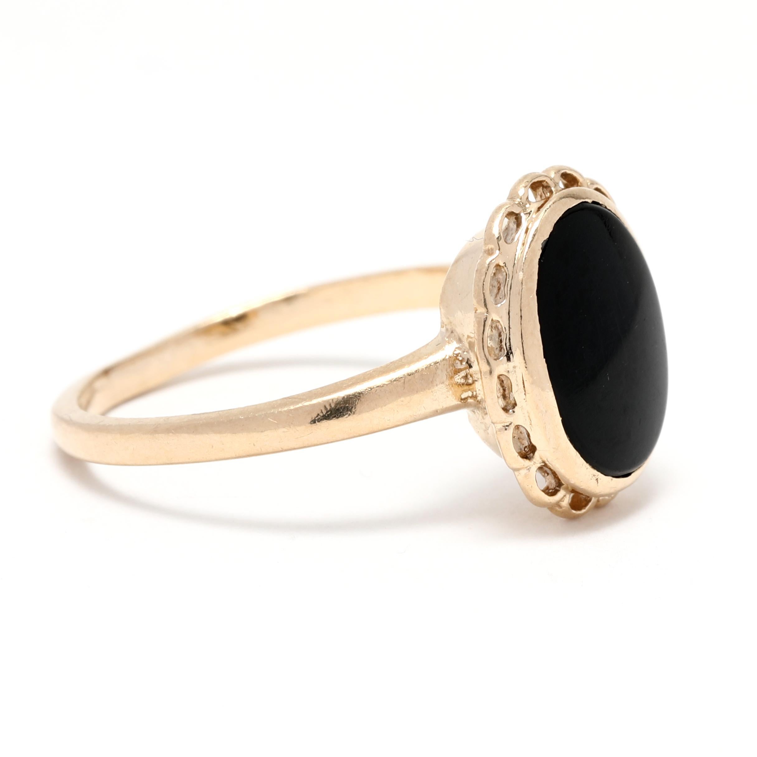 This beautiful bezel oval black onyx ring is crafted from 10K yellow gold and features a striking black onyx stone. This simple yet elegant ring is perfect for a statement piece and is available in a size 5.5. It is the perfect accessory for any