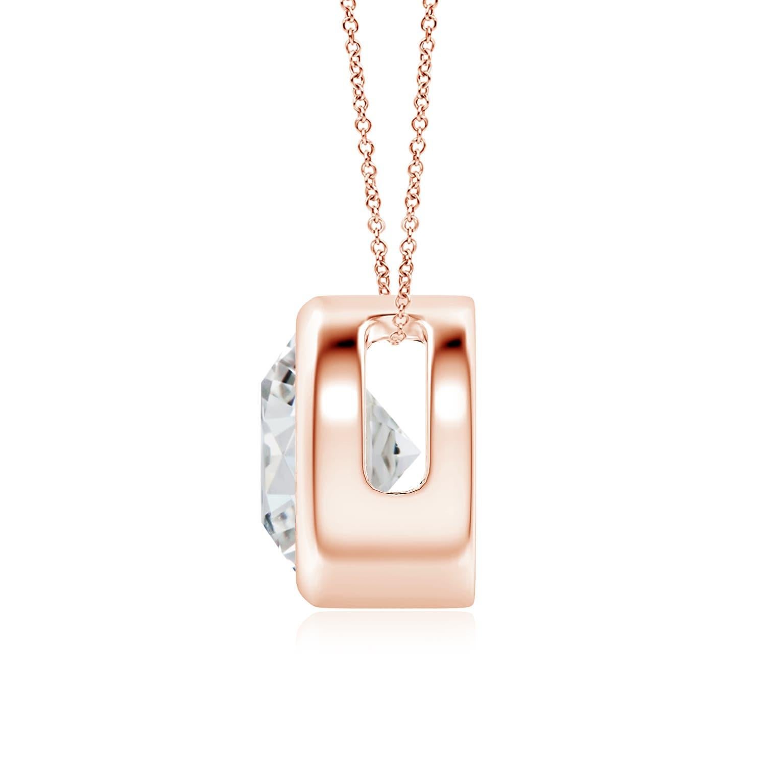 This classic solitaire diamond pendant's beautiful design makes the center stone appear like it's floating on the chain. The sparkling diamond is secured in a bezel setting. Crafted in 18k rose gold, this round diamond pendant makes an elegant style