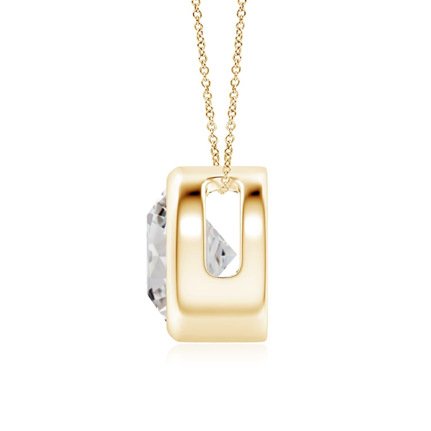 This classic solitaire diamond pendant's beautiful design makes the center stone appear like it's floating on the chain. The sparkling diamond is secured in a bezel setting. Crafted in 18k yellow gold, this round diamond pendant makes an elegant