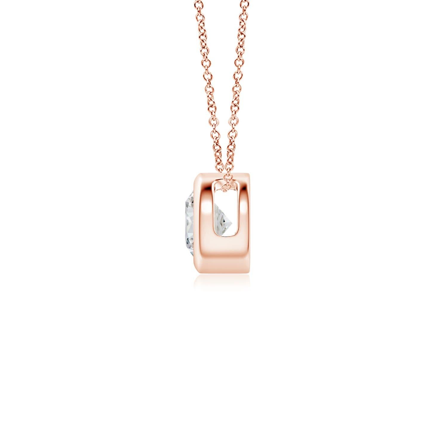 This classic solitaire diamond pendant's beautiful design makes the center stone appear like it's floating on the chain. The sparkling diamond is secured in a bezel setting. Crafted in 18k rose gold, this round diamond pendant makes an elegant style