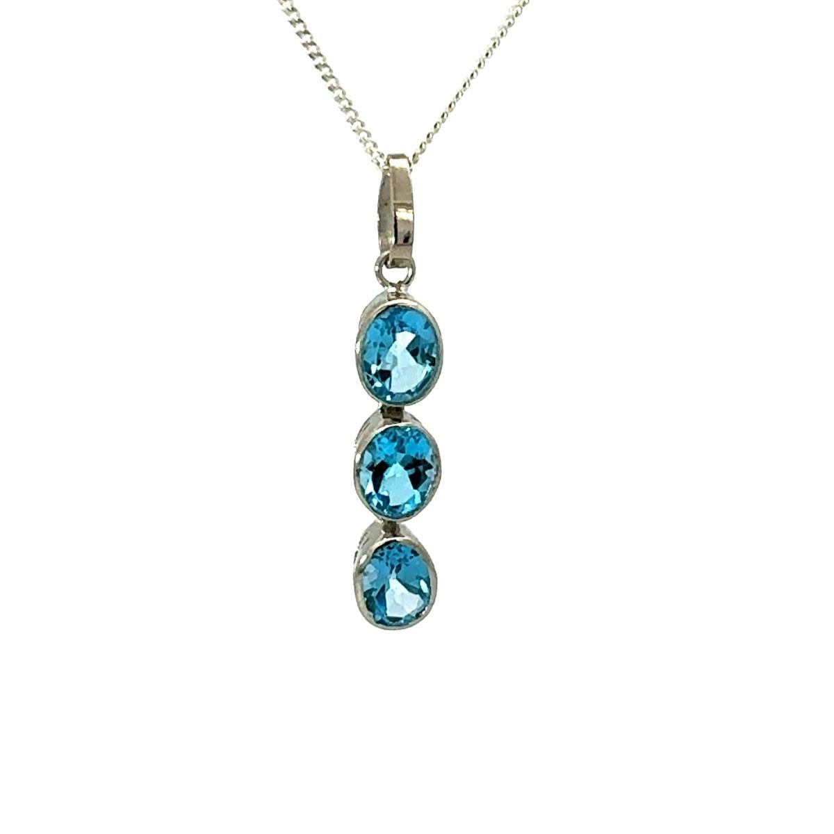 Colgante lineal triple de plata con bisel de 7,49 CTW de topacio azul Regalo de joyería de lujo Corte oval en venta