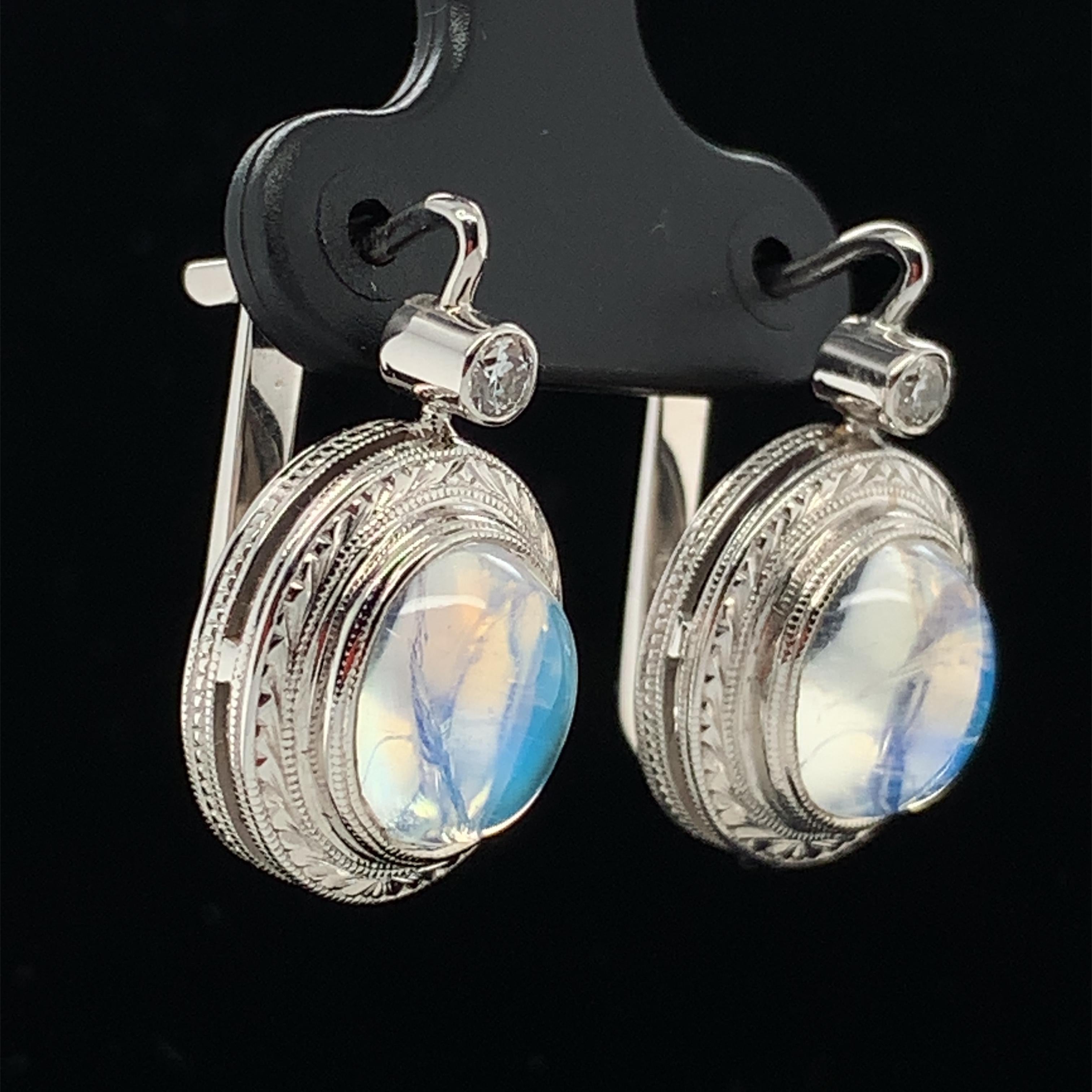Once in a Blue Moon! Very fine quality moonstone cabochons are featured in these beautiful earrings. These moonstones are highly transparent with fine blue adularescence or 