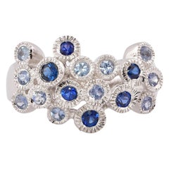 Bezel Set Blue Sapphire Ring in 14 Karat White Gold with Milgrain