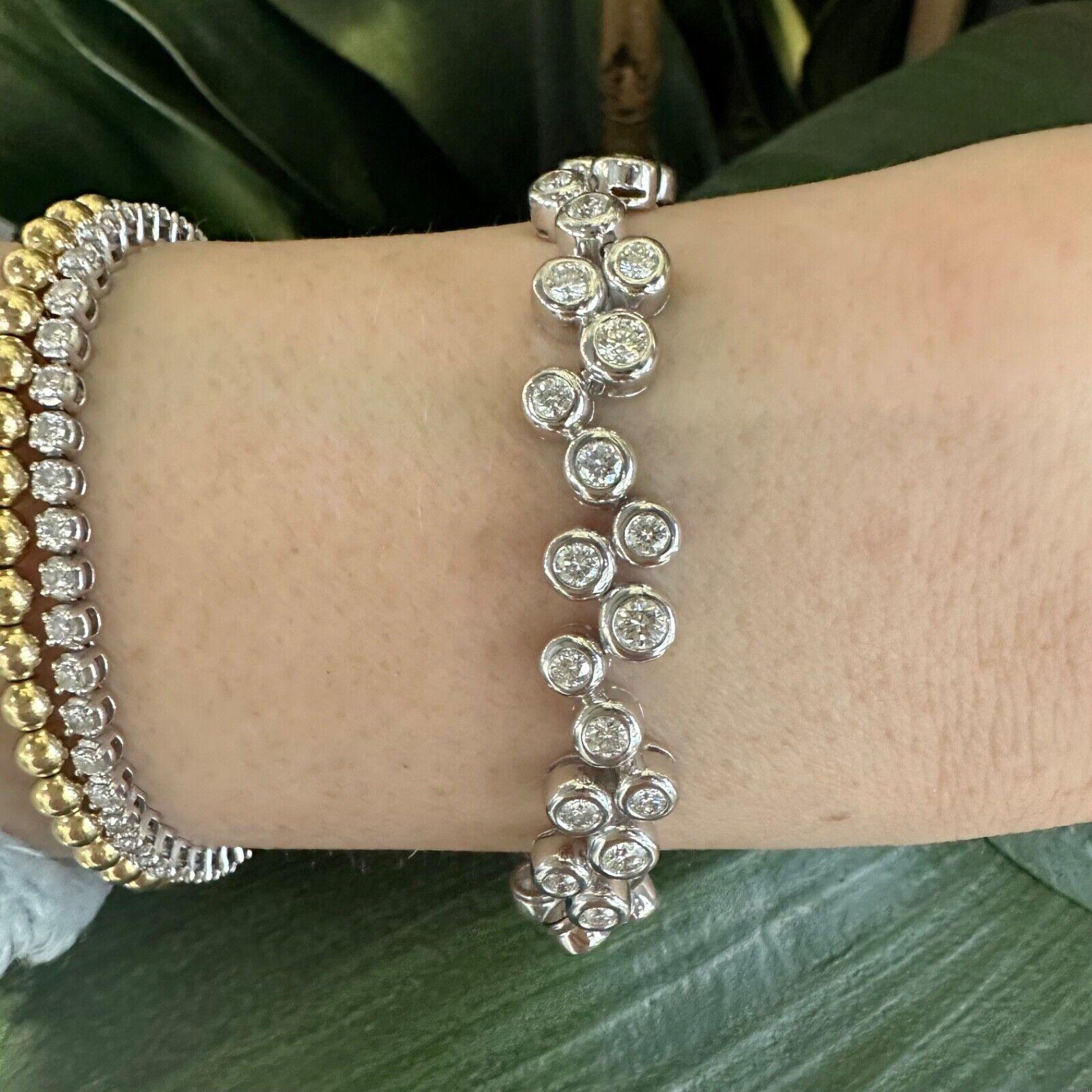 This is a gorgeous tennis bracelet featuring round diamonds, with a total approximate carat weight of 3, is a testament to timeless elegance and luxury. With its brilliant diamonds, adjustable length, and versatility, it is not just a piece of